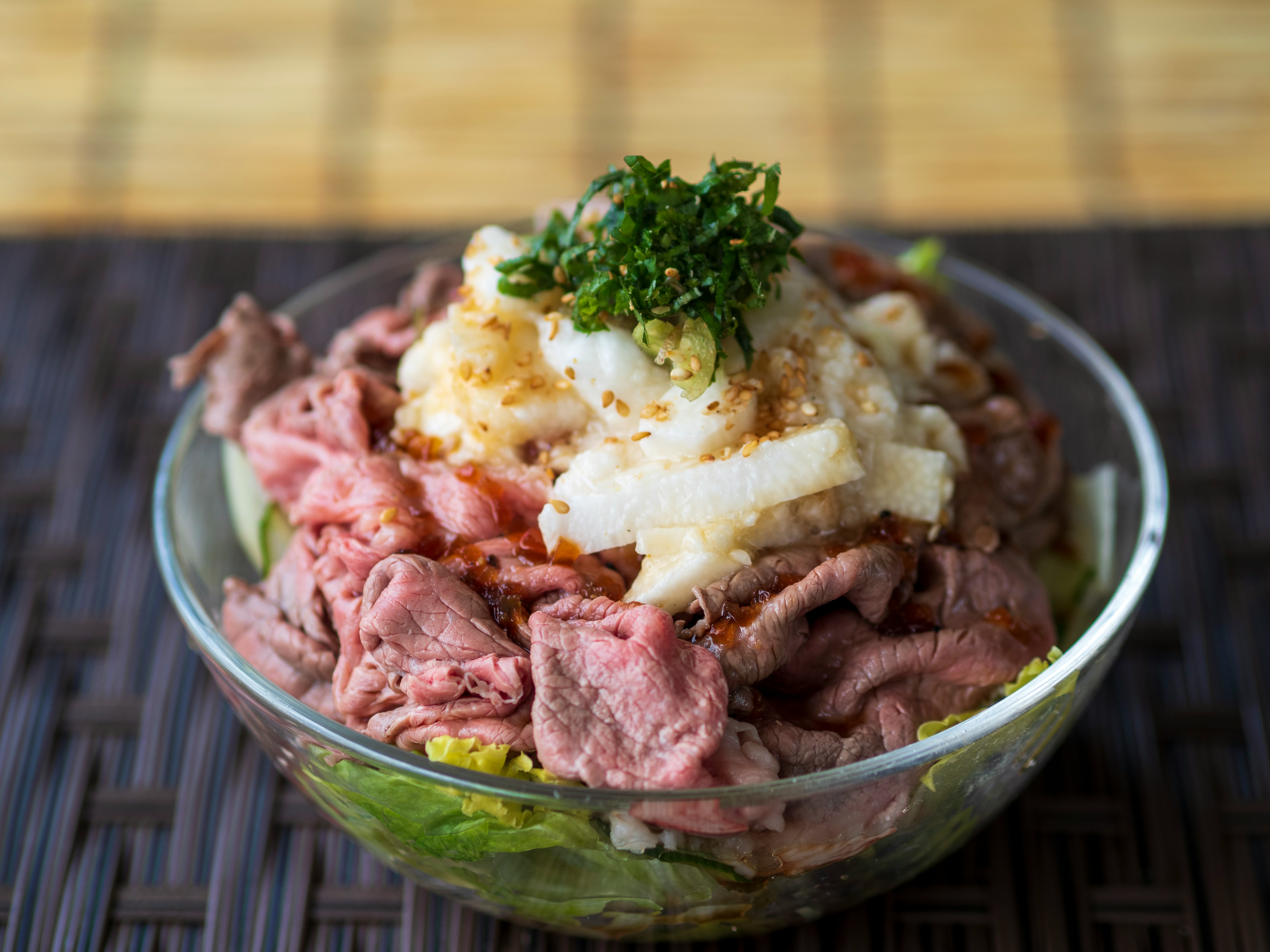 roast beef rice bowl with a runny egg in a bowl