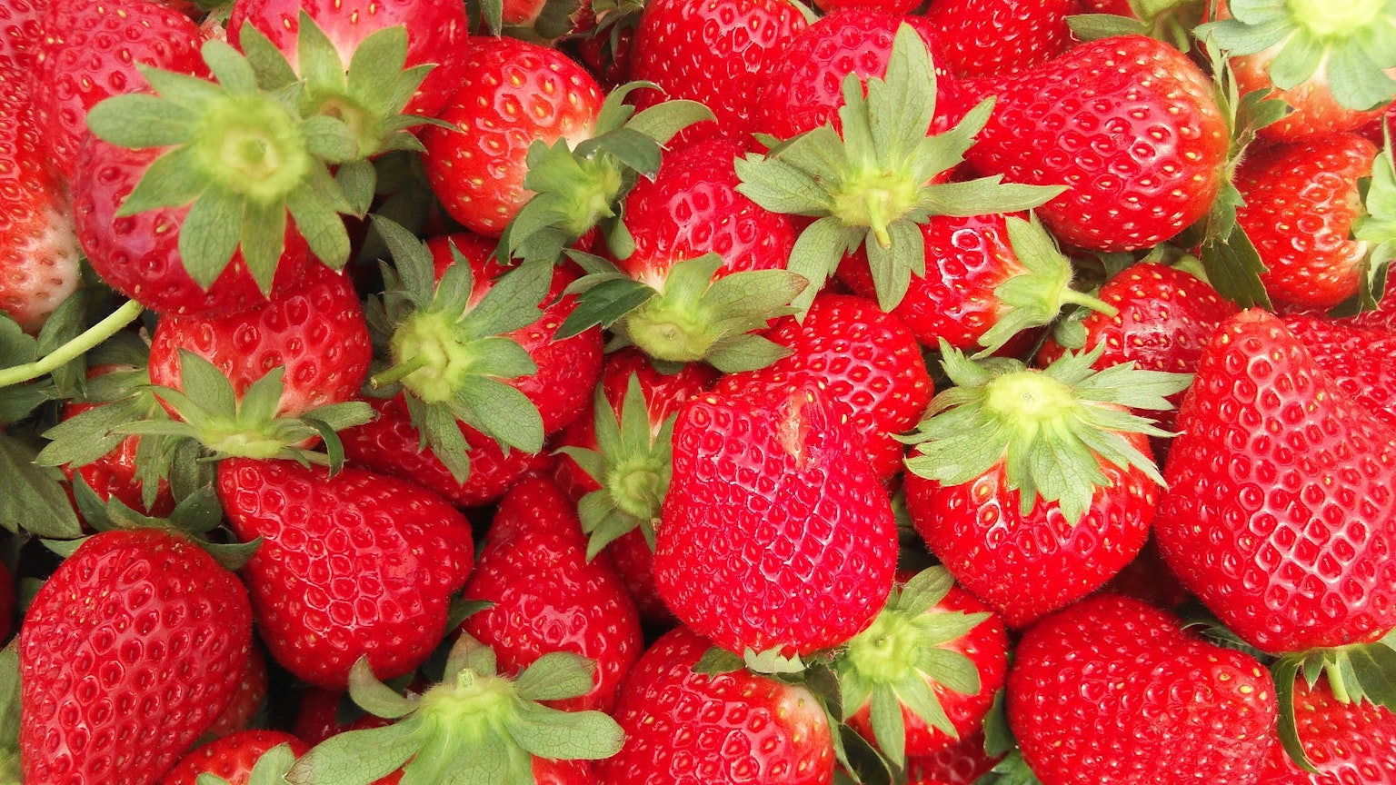 Fresh strawberries piled together