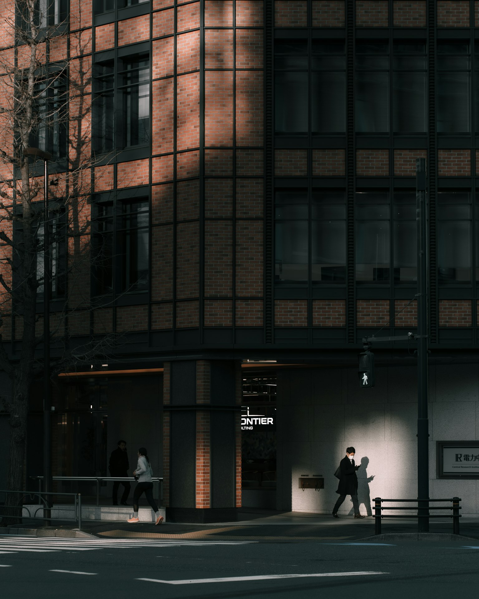 Modern building in cityscape with pedestrians