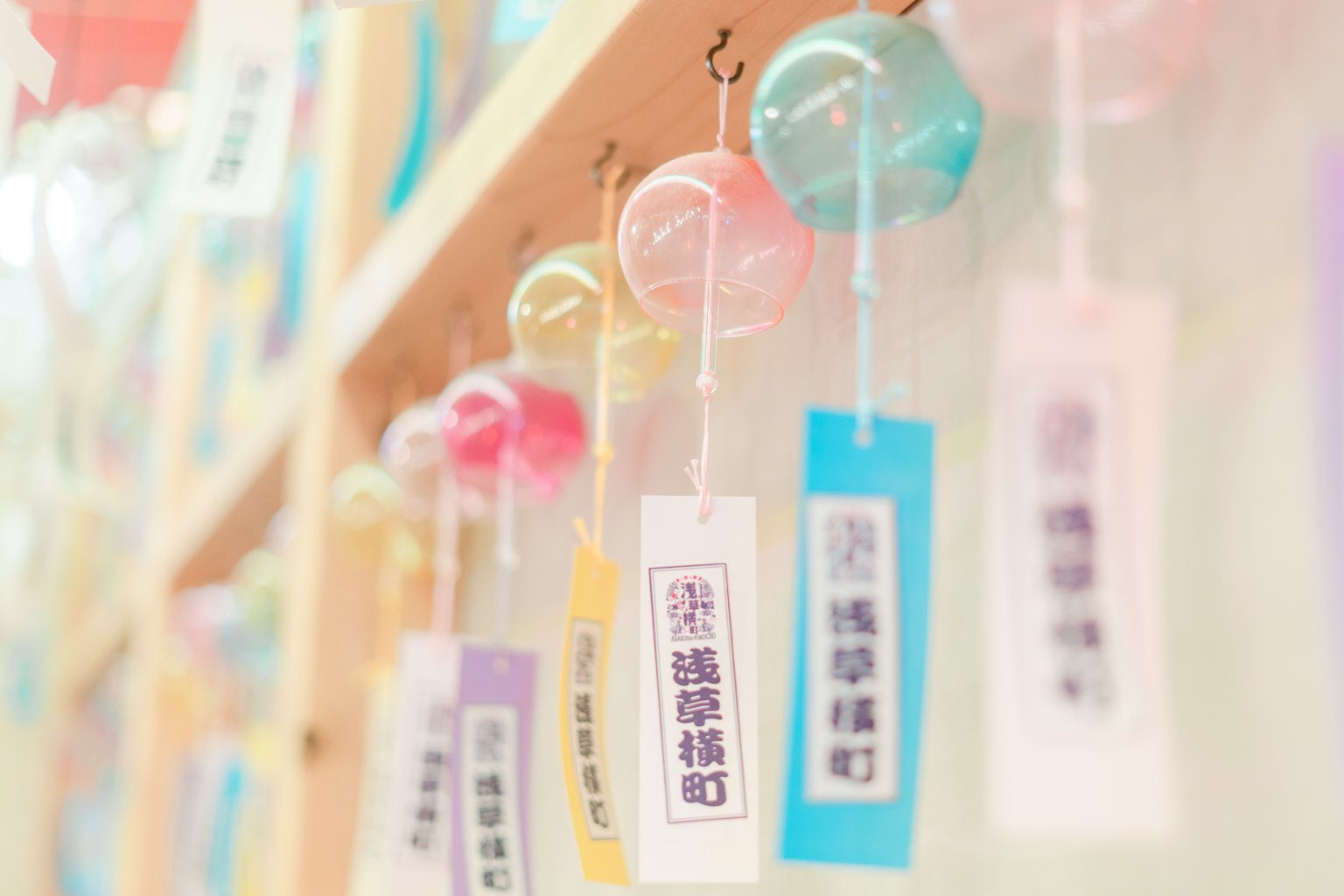 Colorful wind chimes displayed on a wall