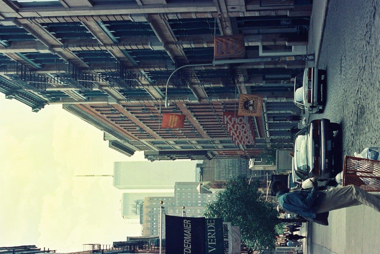 Urban street scene with buildings and vehicles