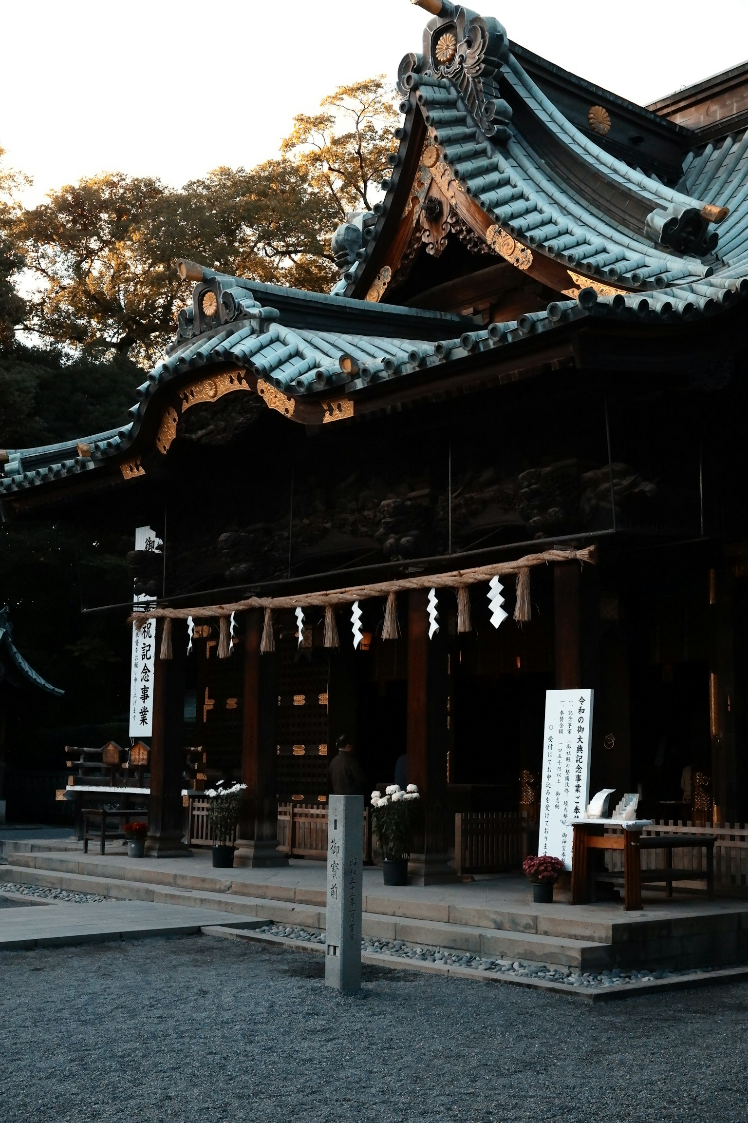 An ancient shrine building illuminated by the sunset