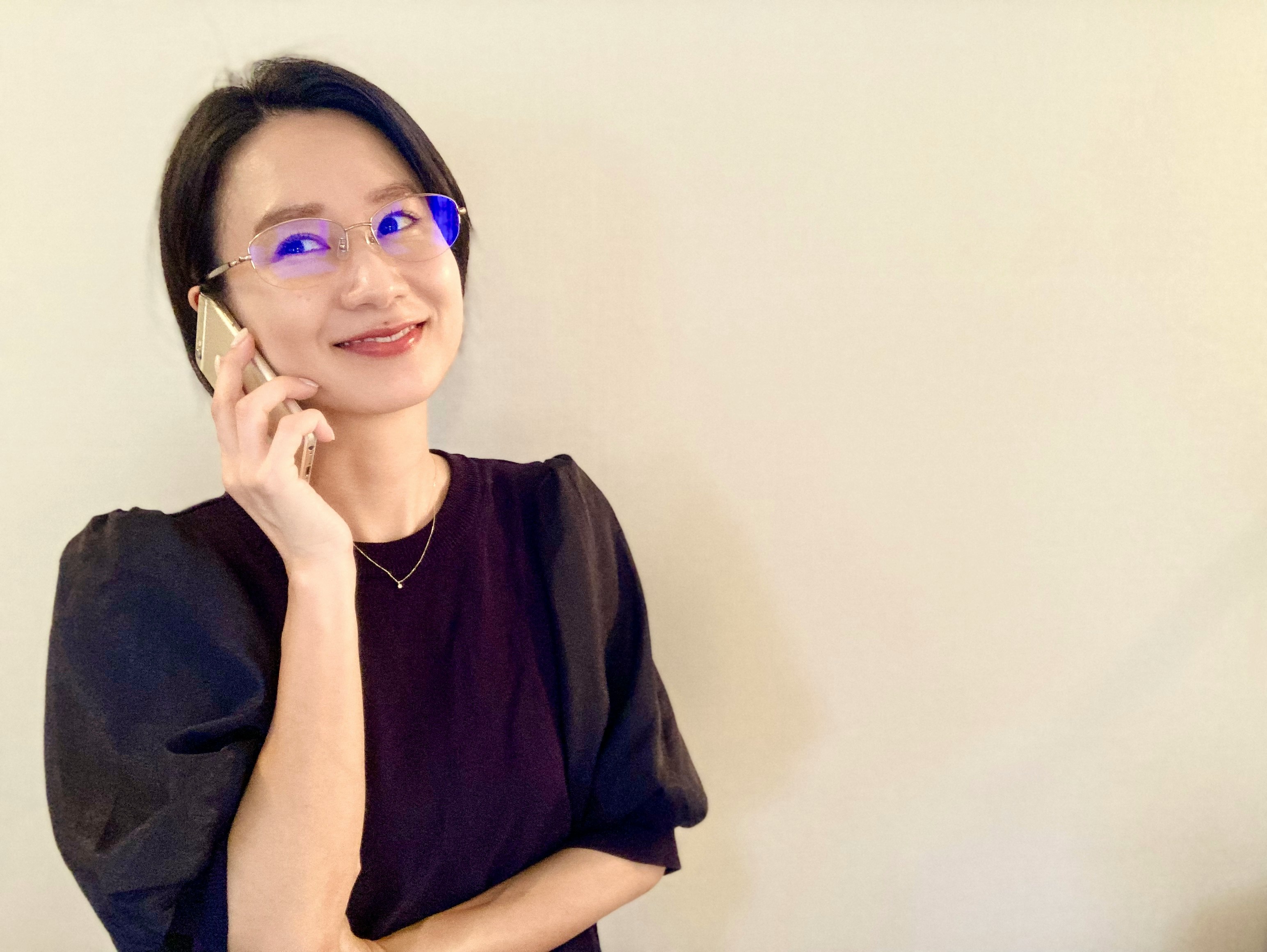 Portrait of a woman wearing purple glasses