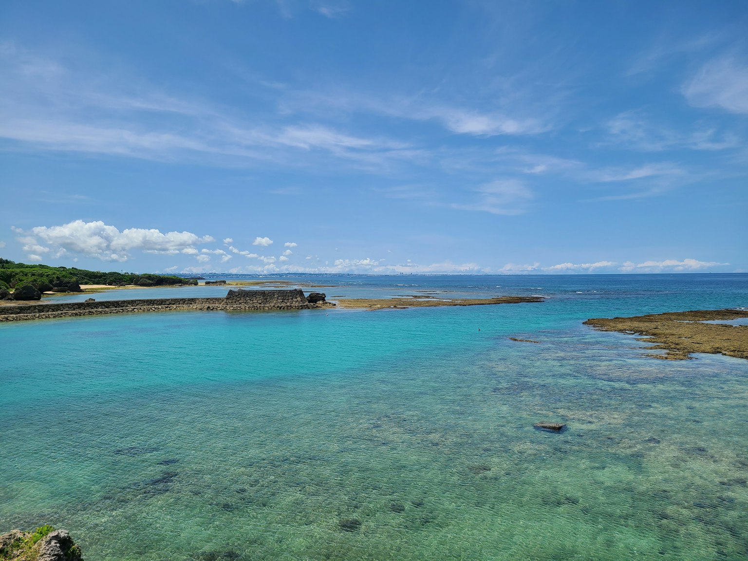 Scenic view of blue sea and sky clear water and visible reefs