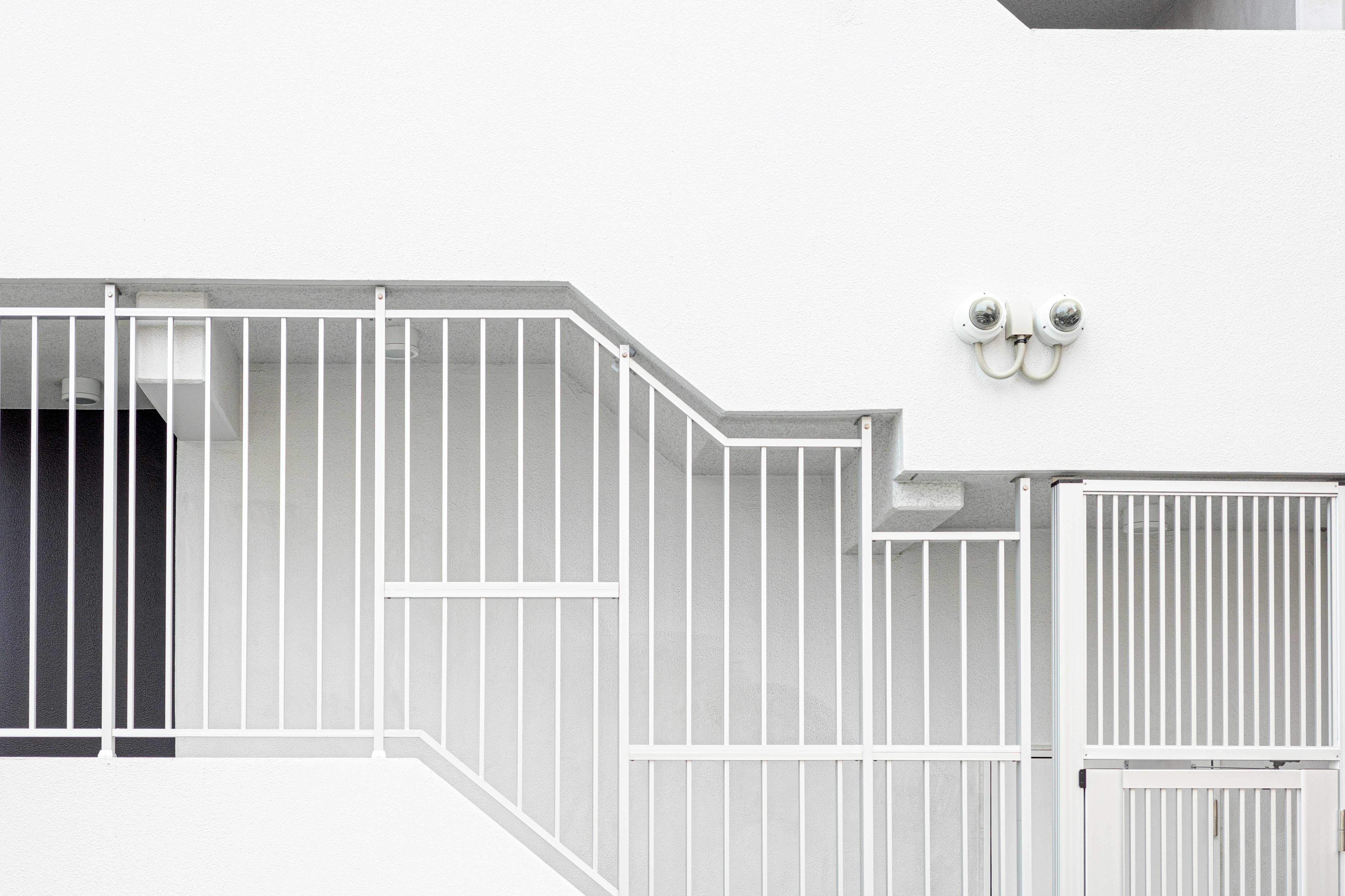 Exterior view of a white staircase and railings
