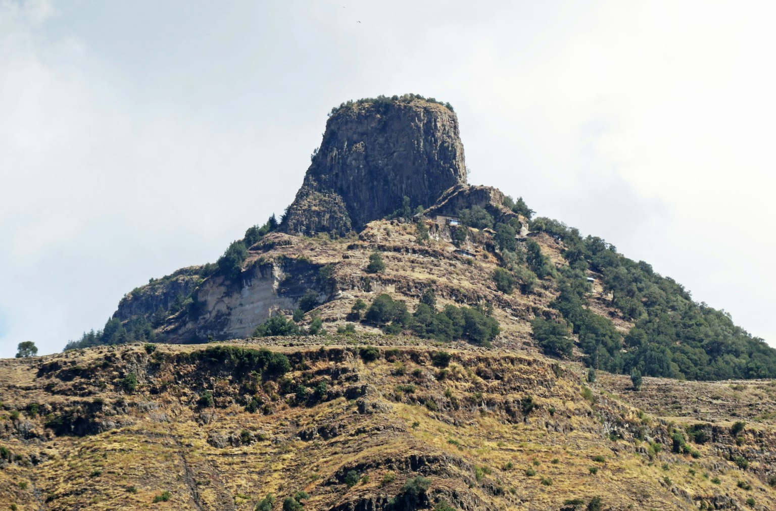 Rock formation towering on a mountain peak