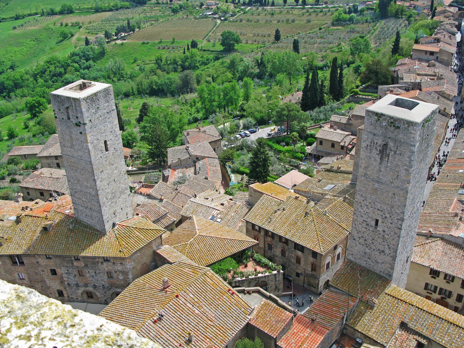 Towers of San Gimignano overlooking green countryside