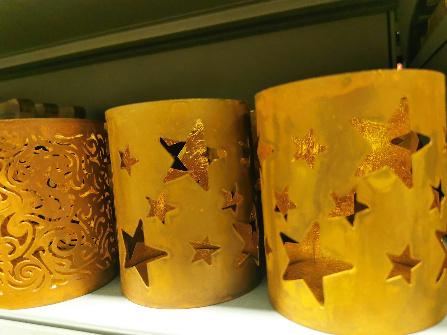 Orange candles with star-shaped cutouts
