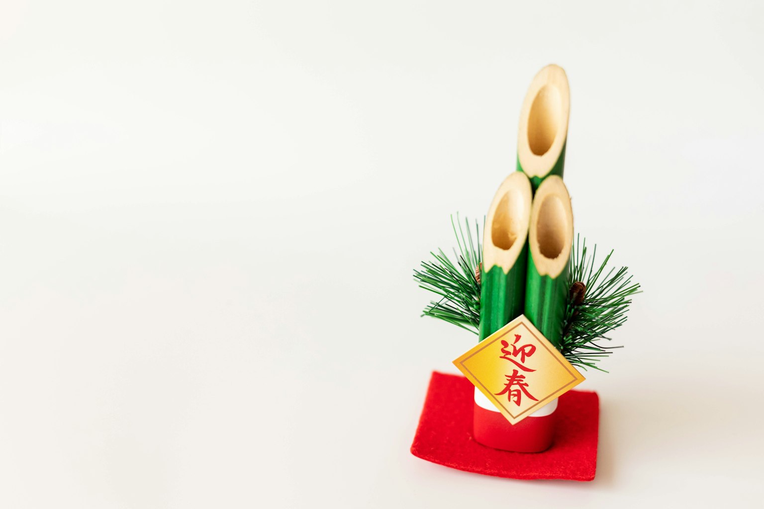Traditional Japanese New Year decoration featuring bamboo and pine branches