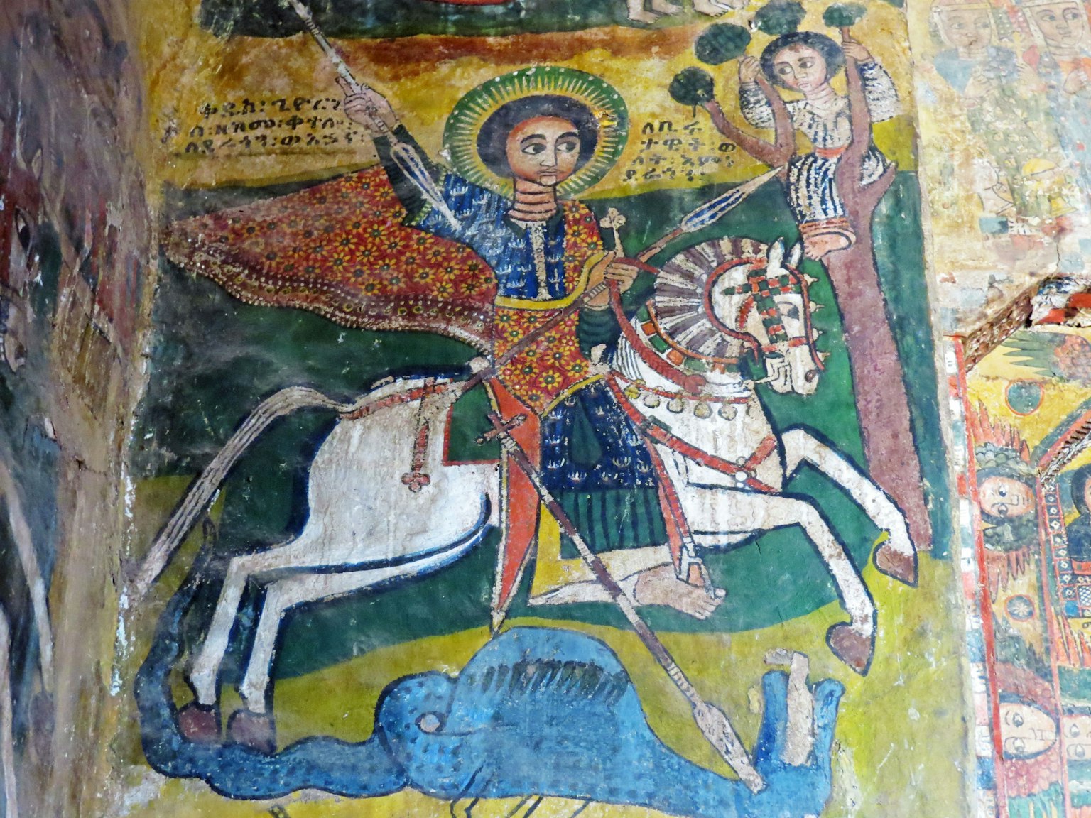 Santo a cavallo che sconfigge un demone in un affresco