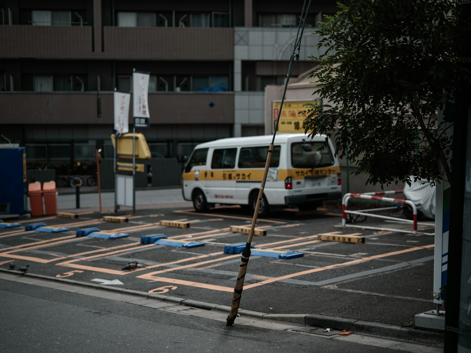 Taxi parked in a parking lot with empty parking spaces