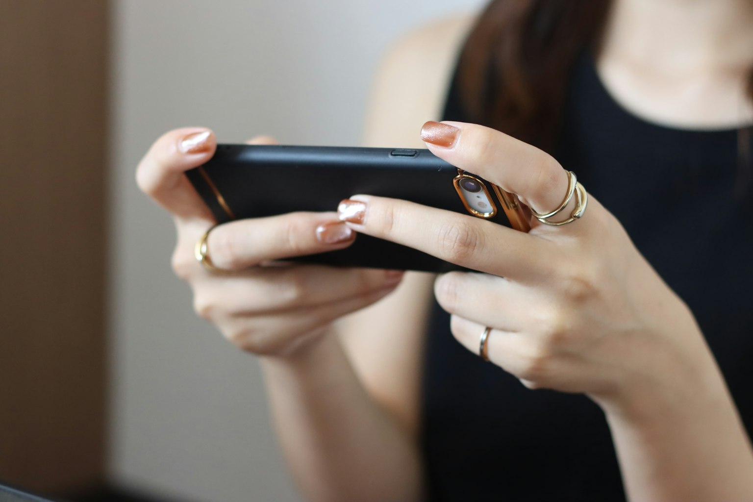 Close-up of a woman's hands holding a smartphone
