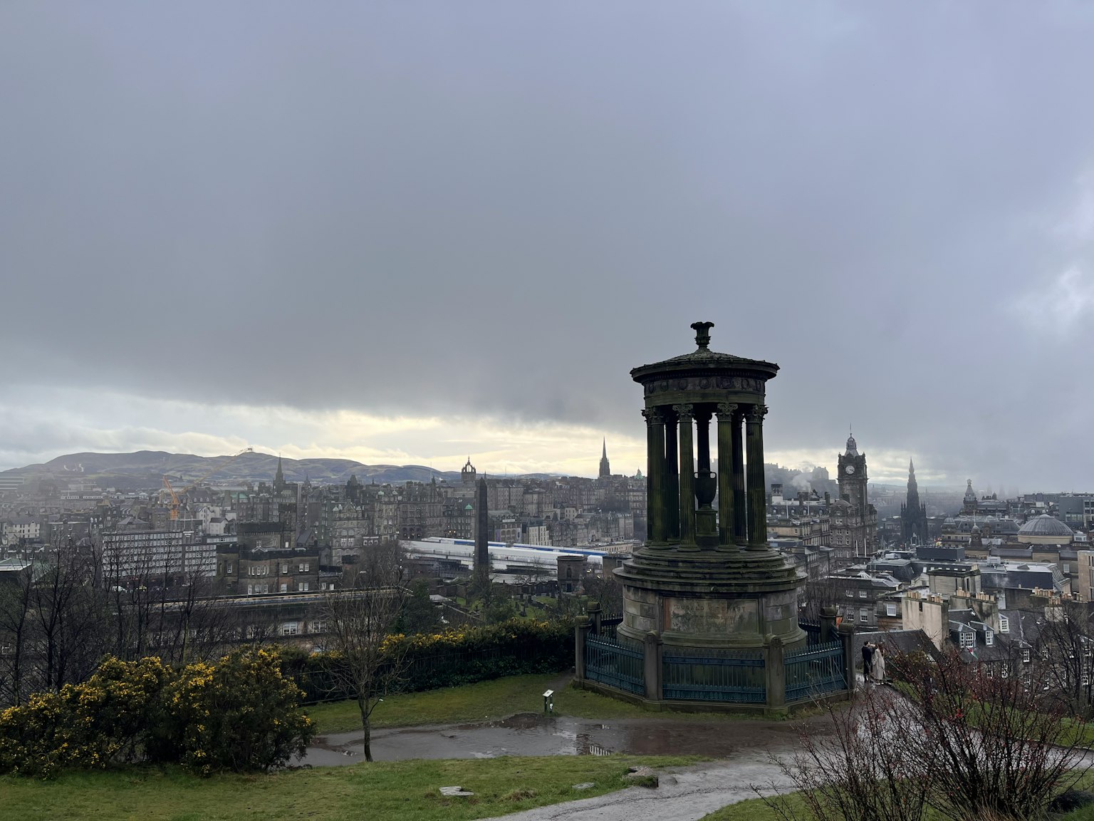 Nelson Monument on Calton Hill in Edinburgh under a cloudy sky