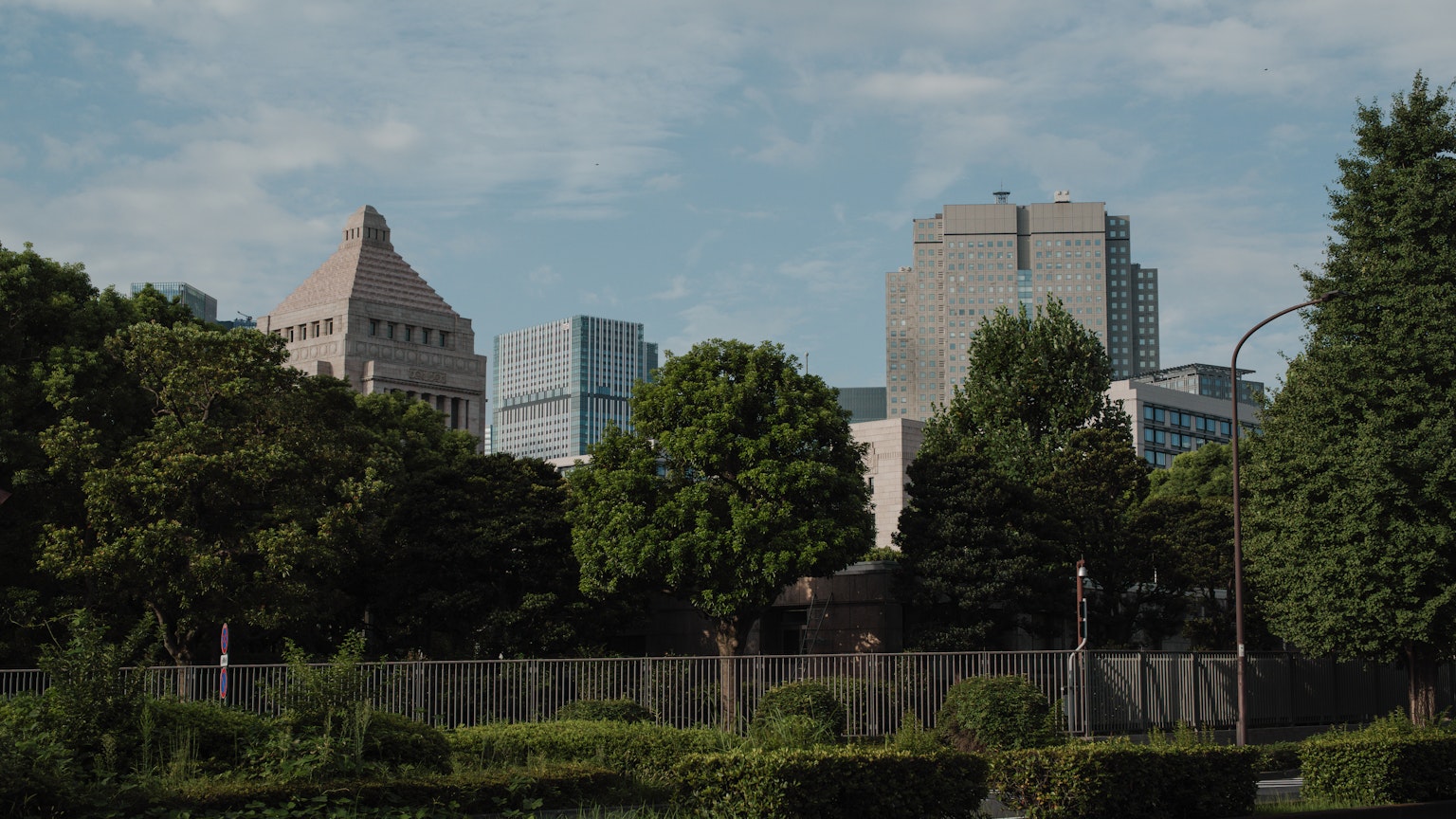 City skyline featuring modern buildings and lush greenery