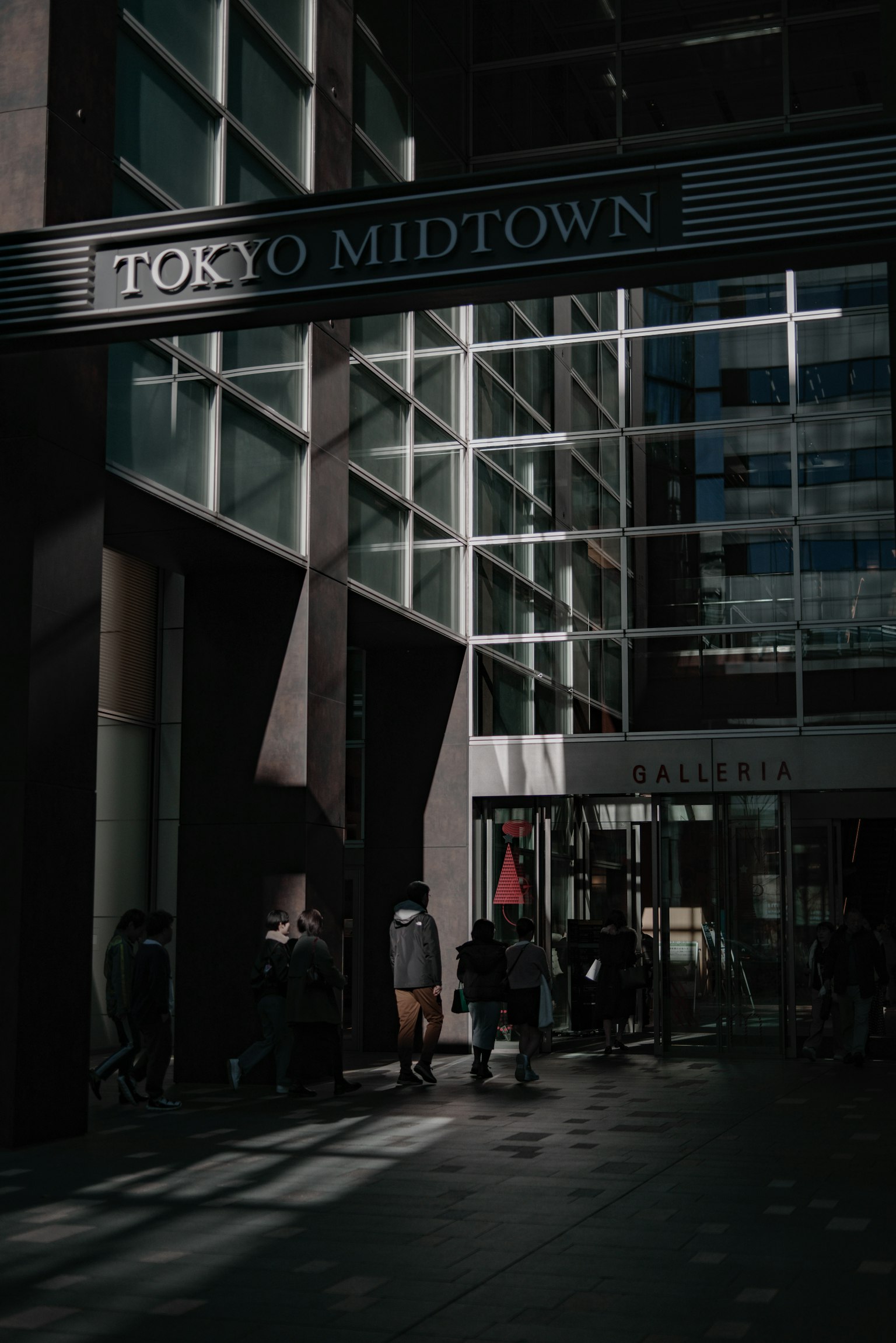 People walking at the entrance of Tokyo Midtown