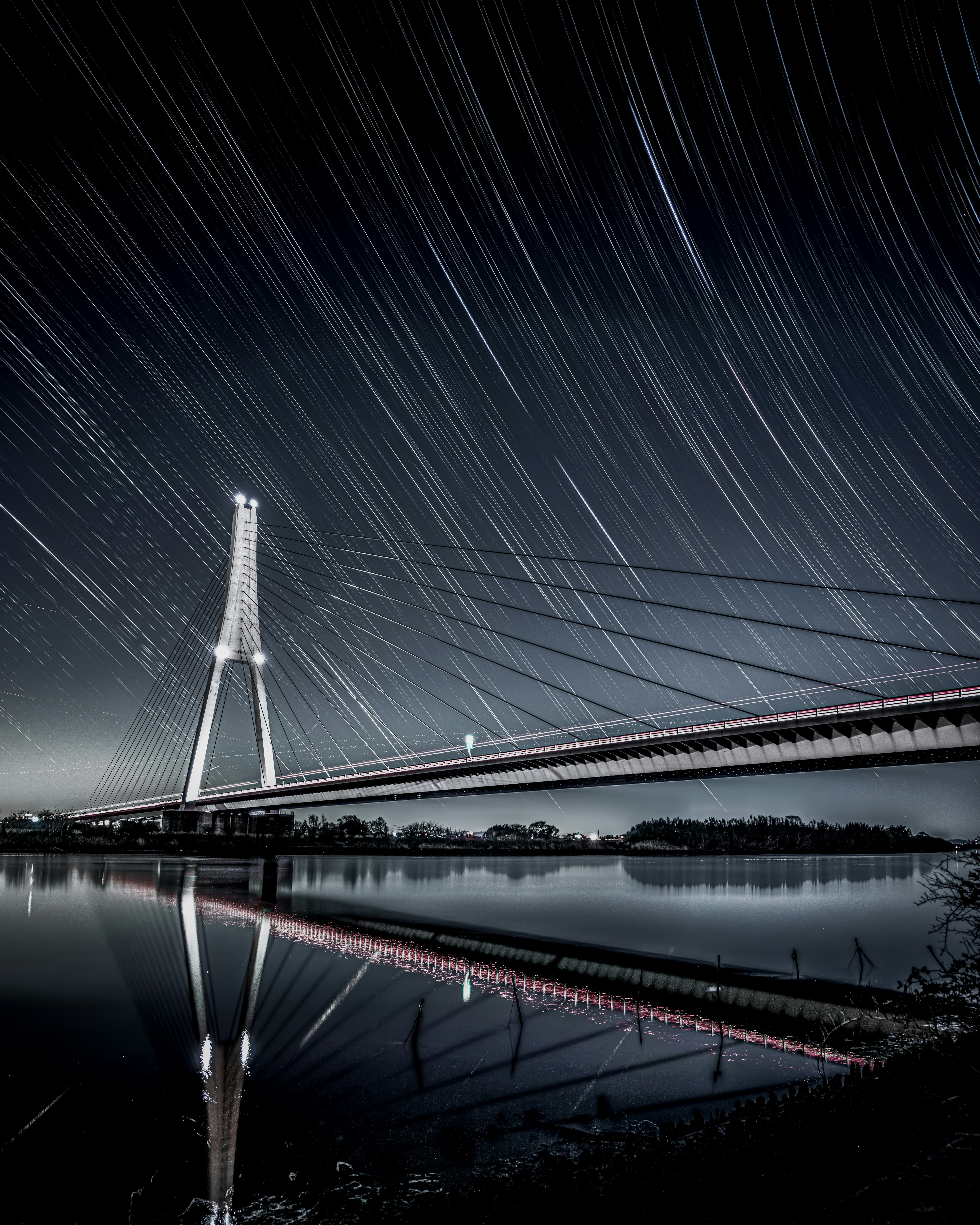 Star trails over the Nakagawa River and Shin-Nakagawa Ohashi Bridge at night