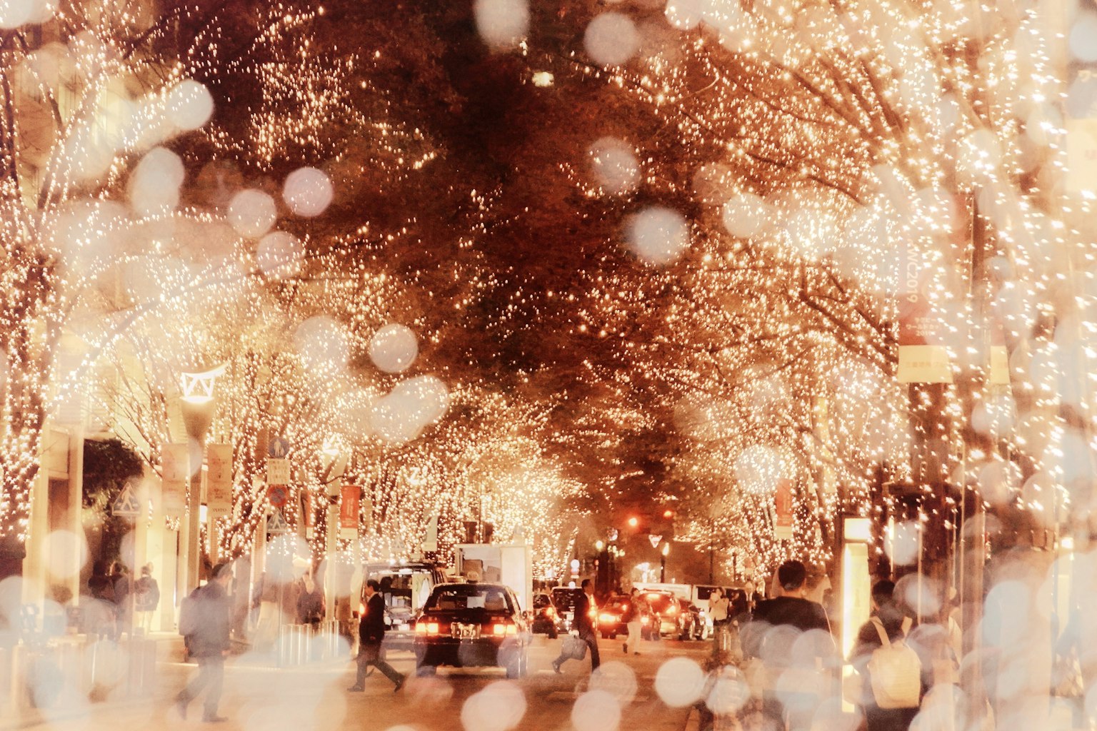 Night scene of a city street adorned with sparkling lights