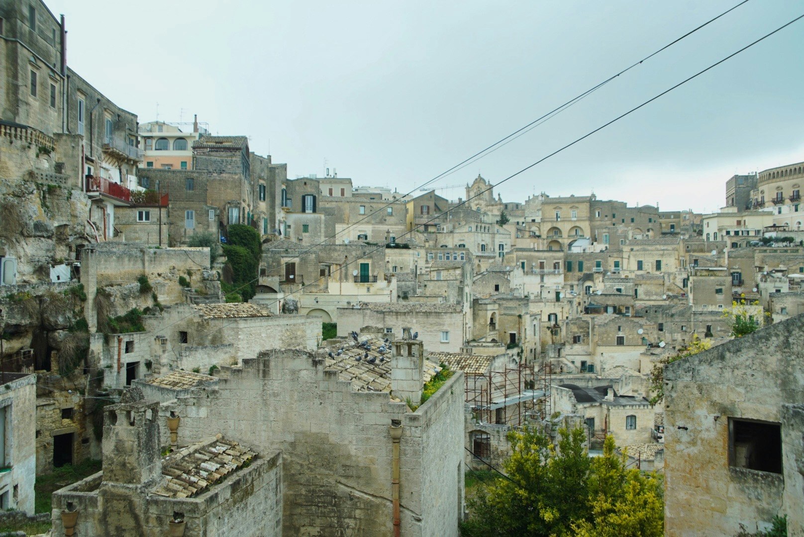 ruined stone buildings in an old town streetscape