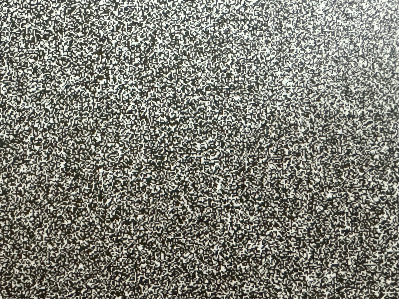 Surface avec des particules grises fines uniformément réparties