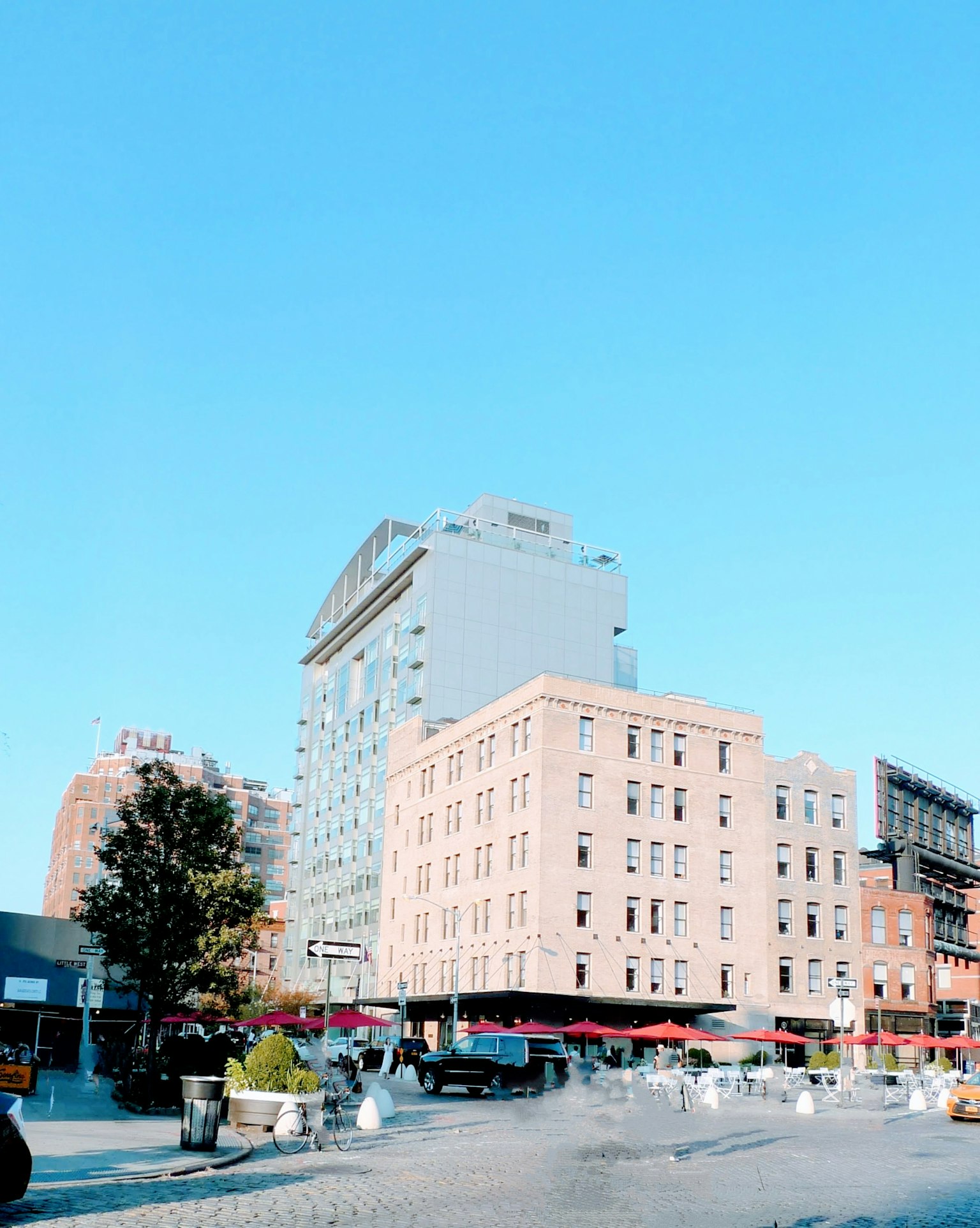 Urban scene under blue sky featuring old and modern buildings