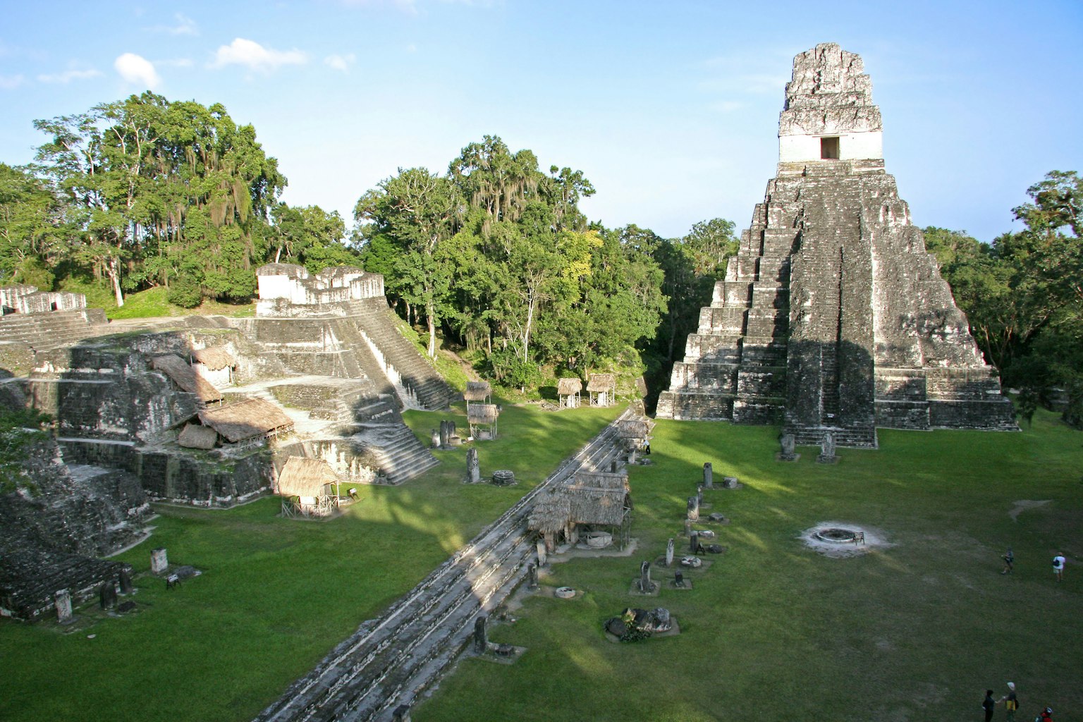 Temple of Tikal surrounded by lush greenery and ancient ruins
