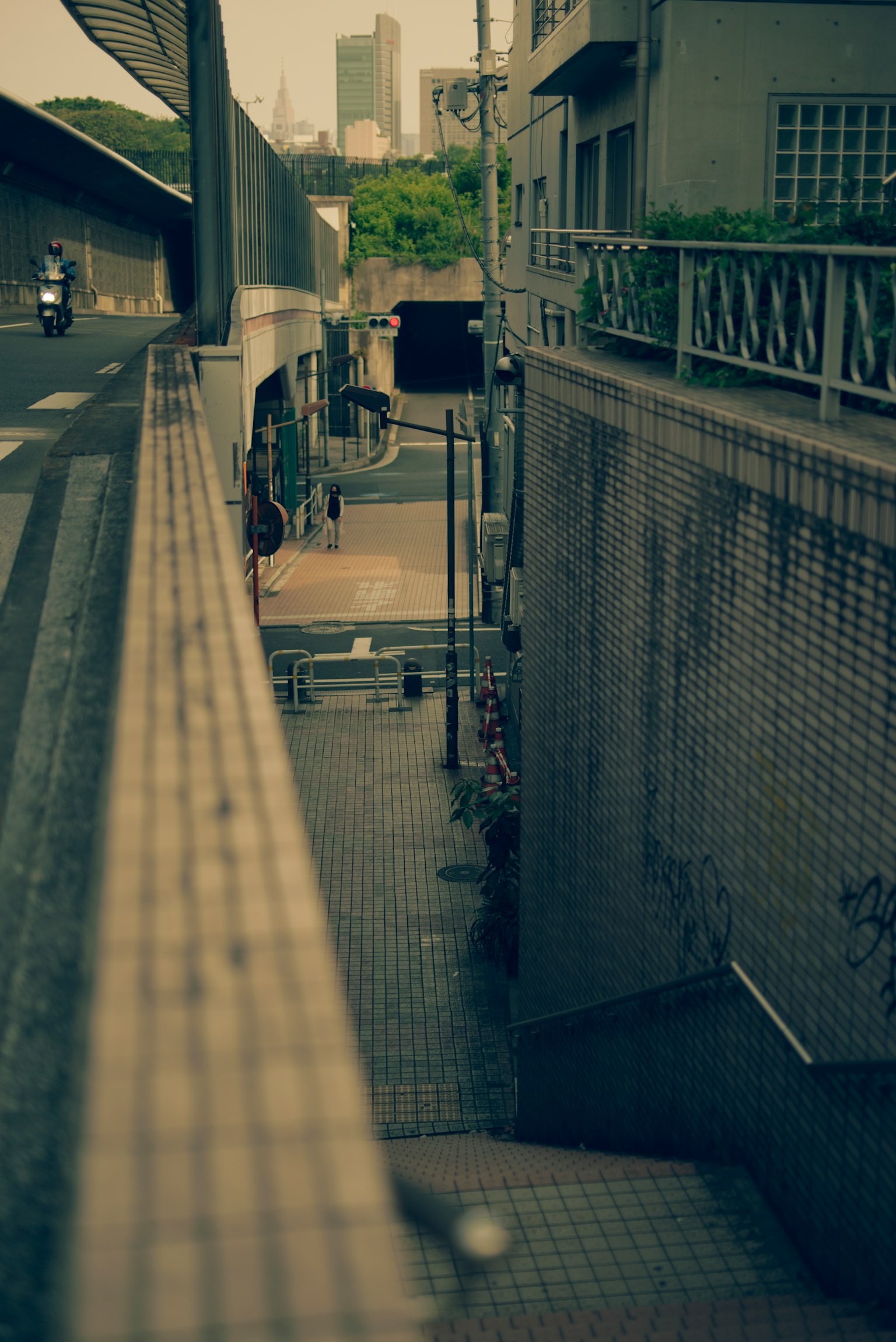 Narrow staircase in an urban alley with buildings
