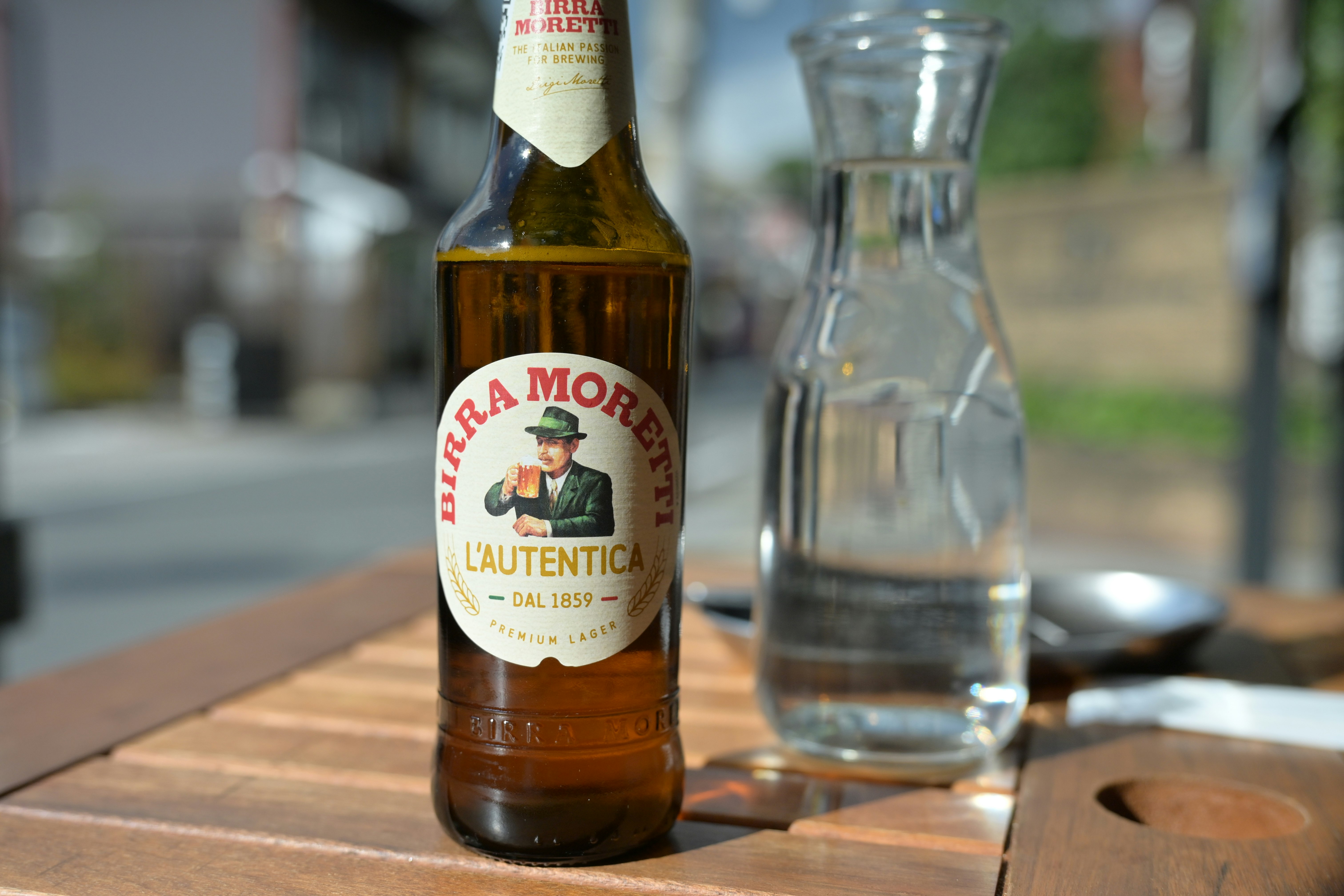 bottle and glass on a wooden table