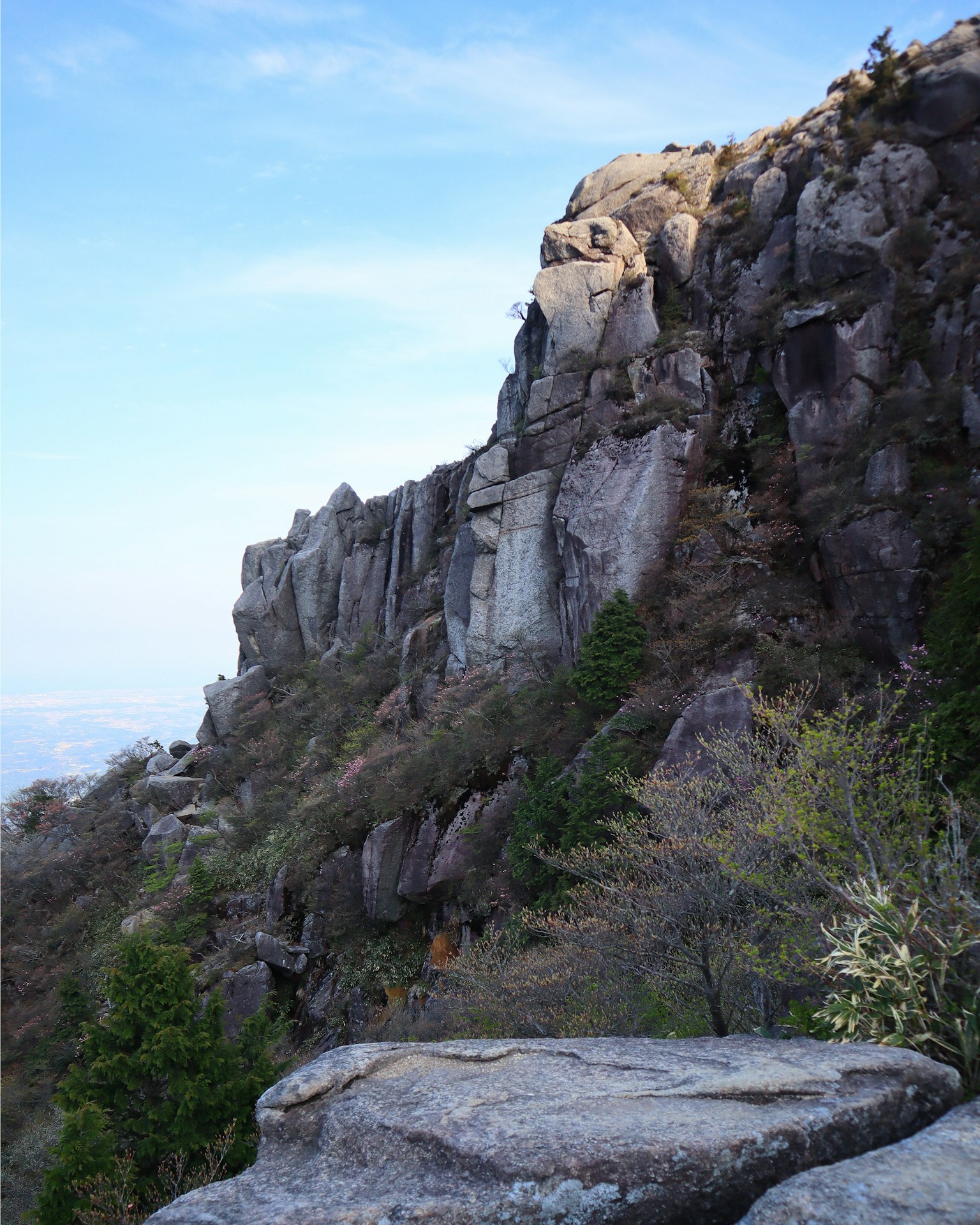 Mountain landscape with scattered rocks and blue sky