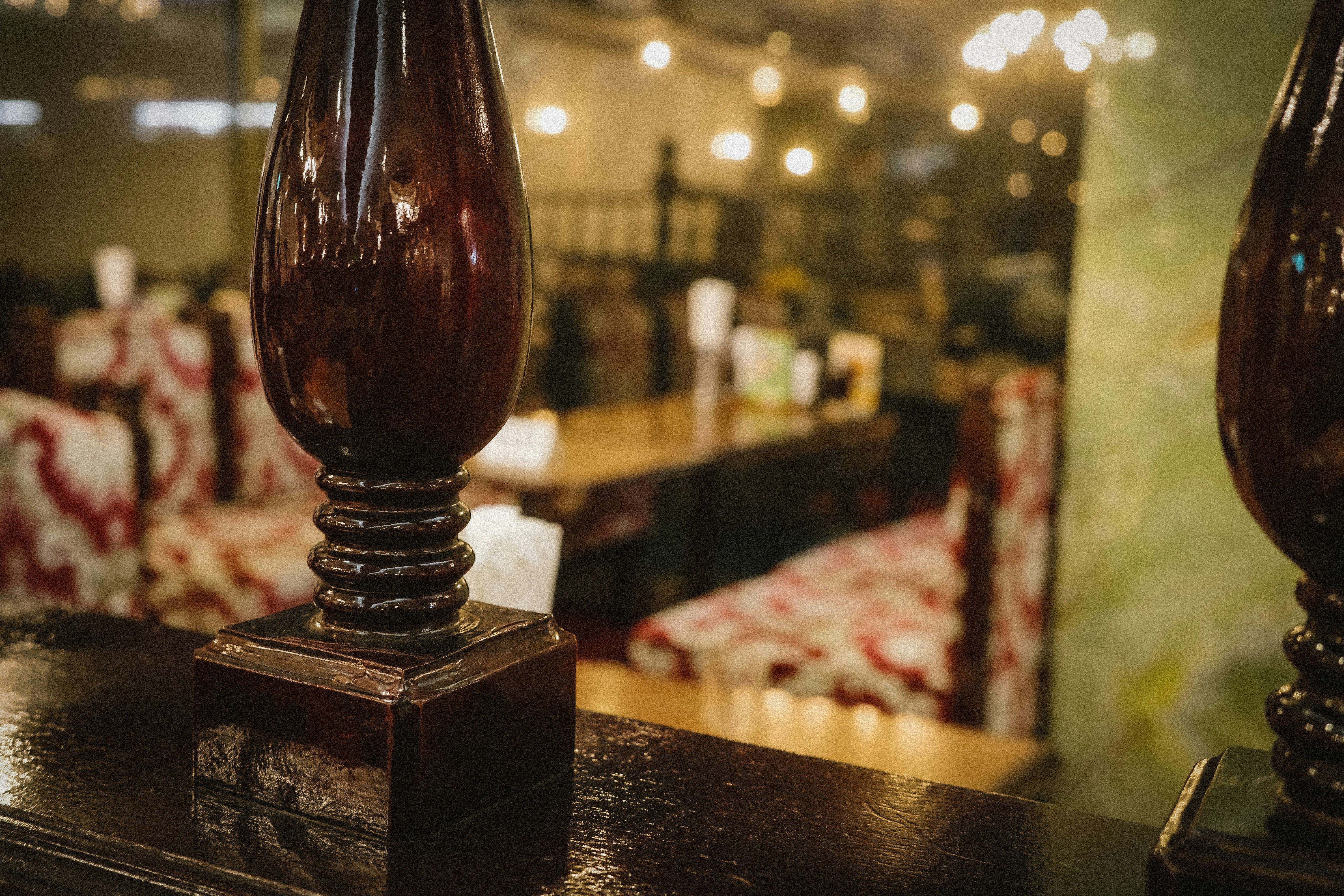 cafe counter with glass bottles and a wooden cork stopper