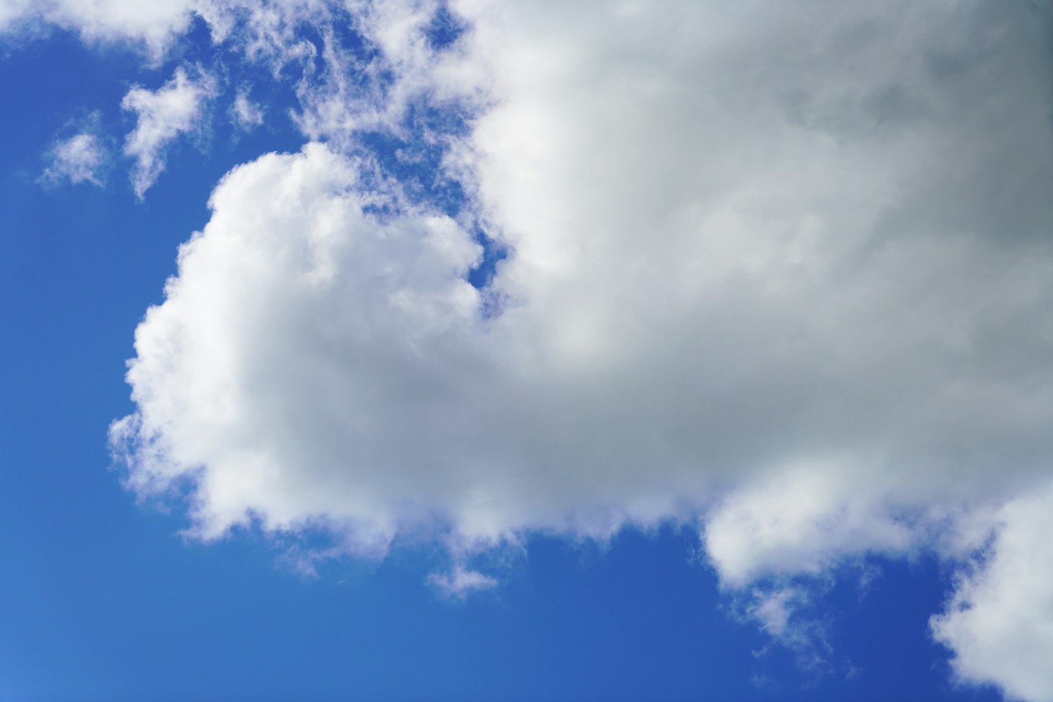 Close-up of white clouds against a blue sky