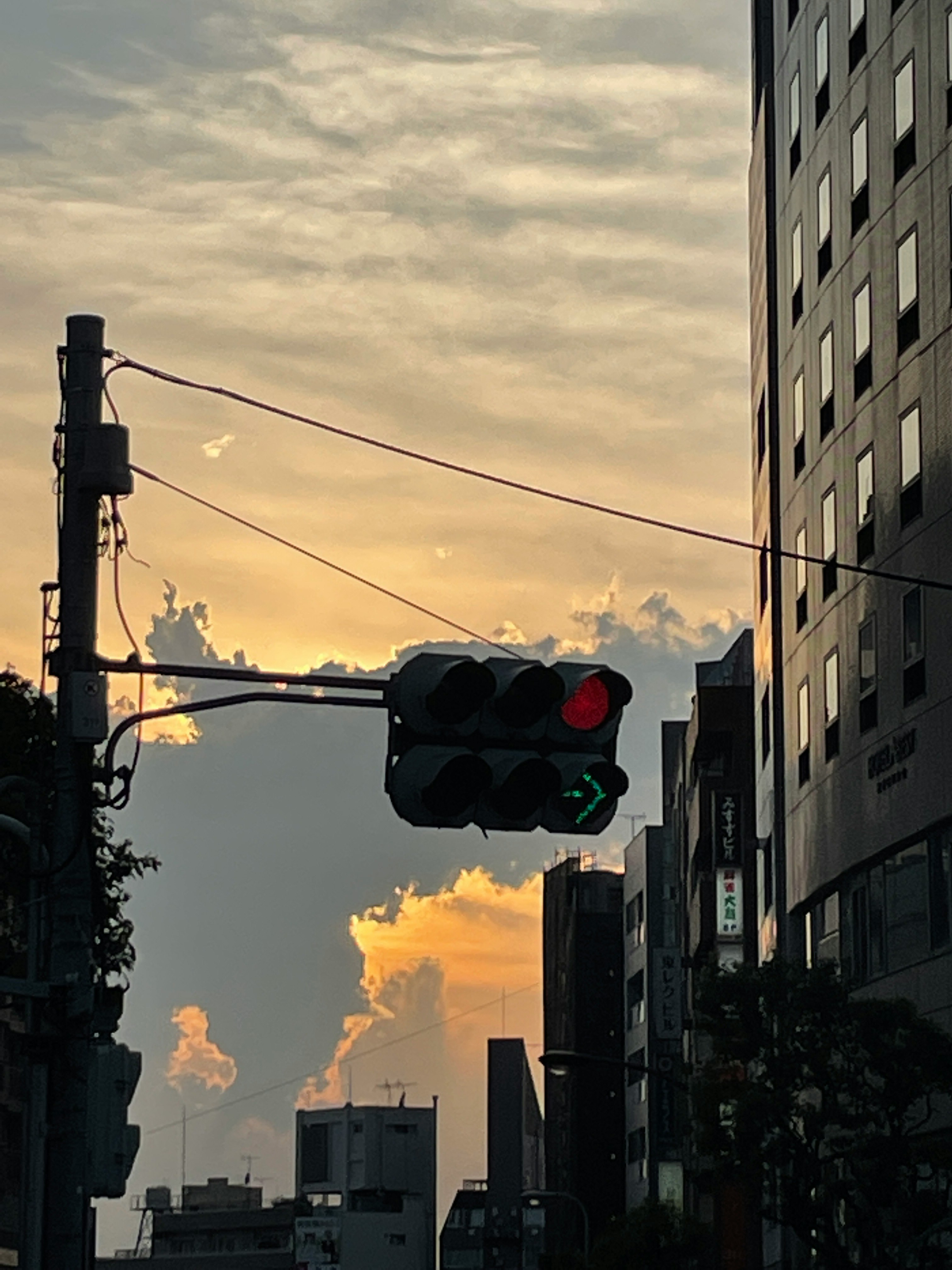 traffic lights at a city intersection during sunset