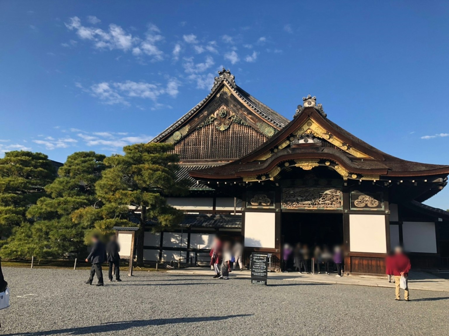 Beautiful traditional Japanese architecture under blue sky with visitors