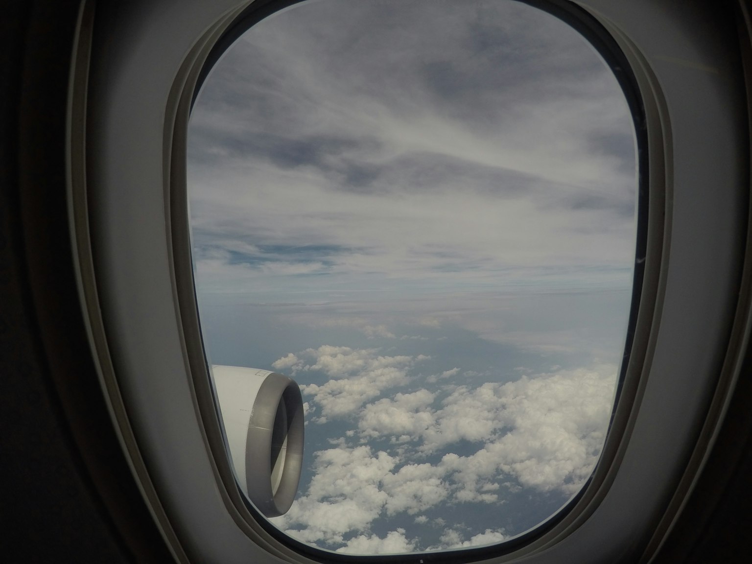 View of clouds and sky from an airplane window