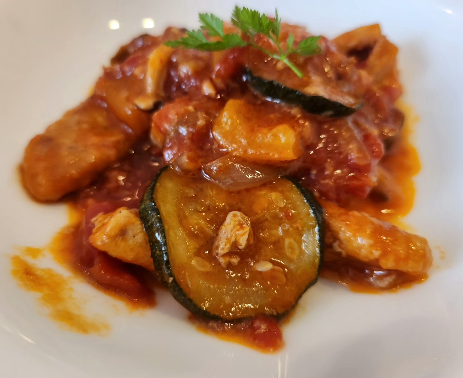 Chicken and zucchini dish simmered in tomato sauce