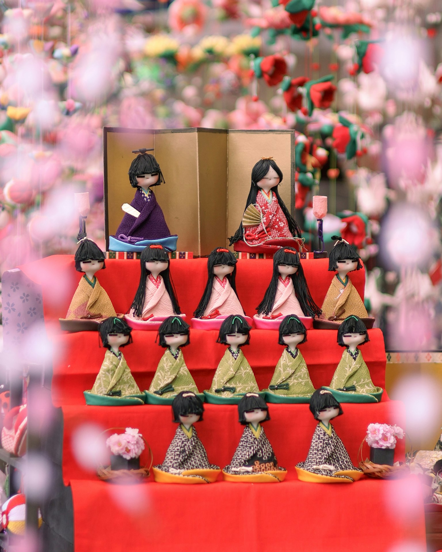 Colorful traditional dolls arranged in a Hinamatsuri display