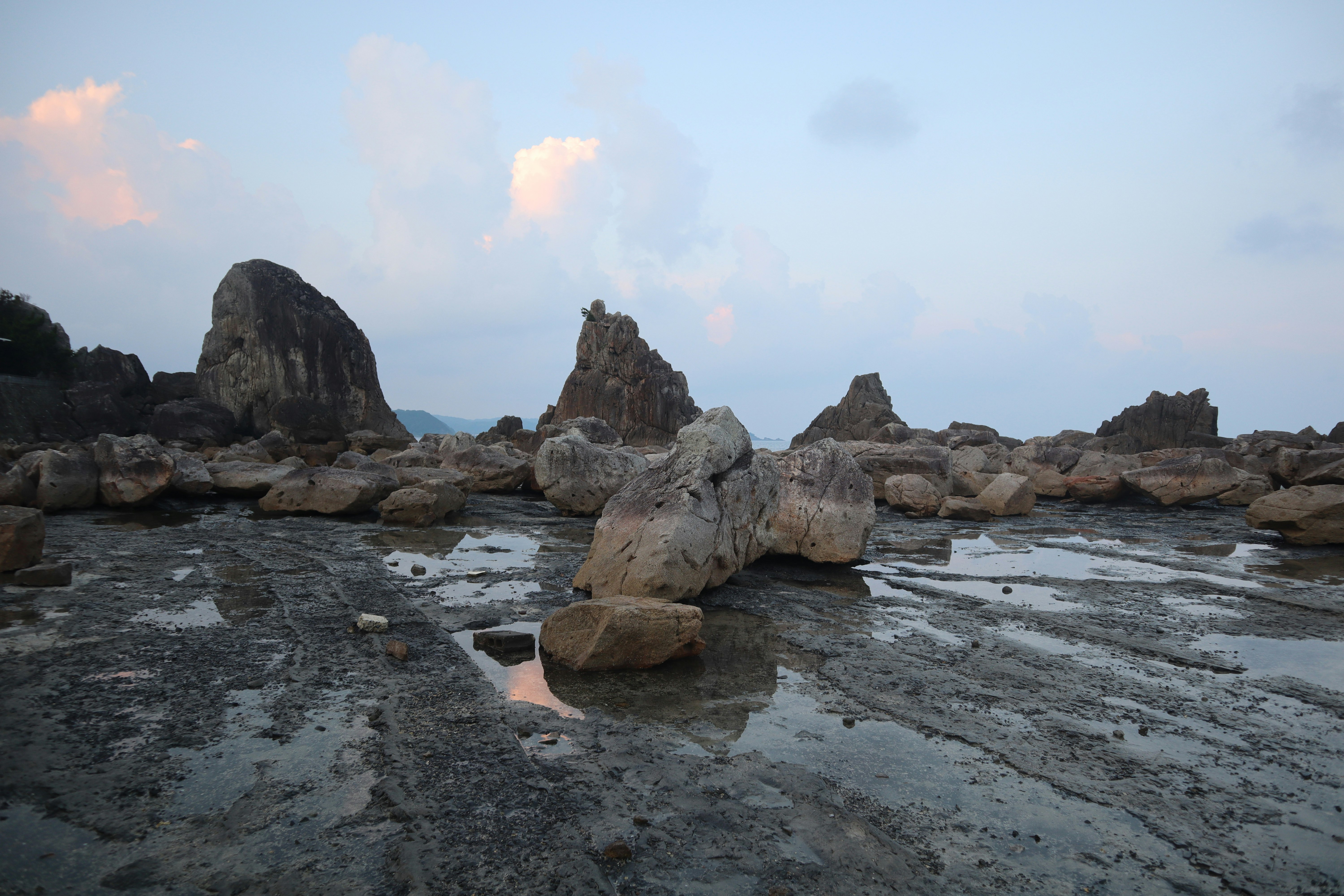 rocky shoreline with waves and rough sea scenery