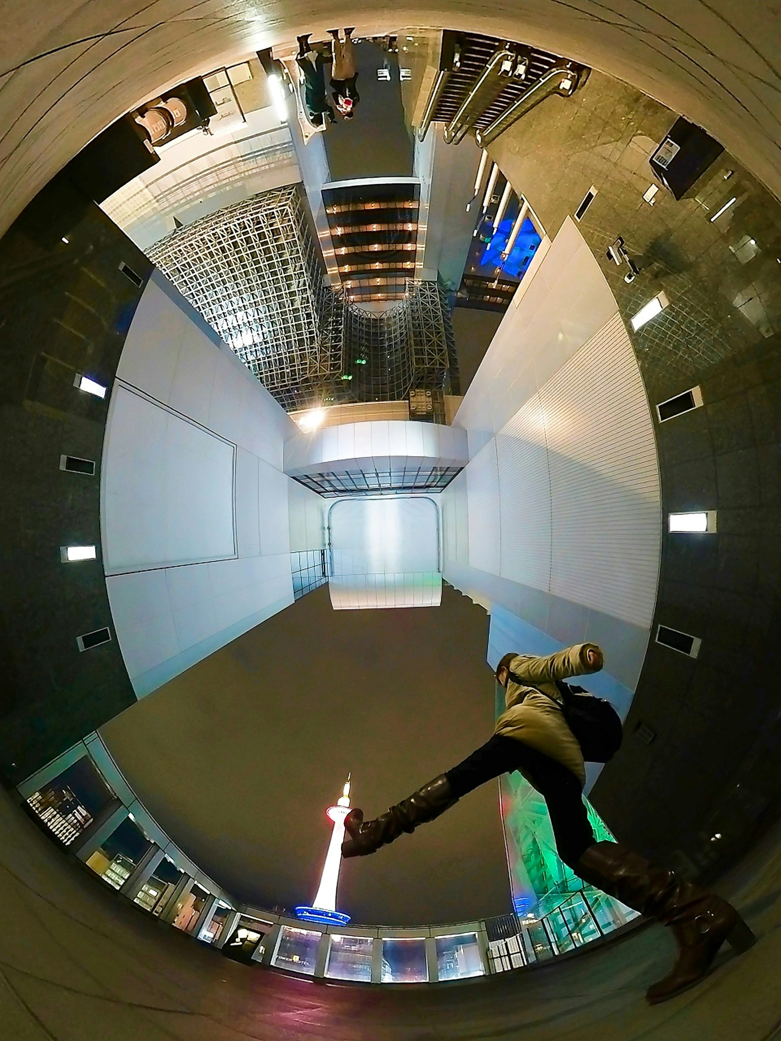 A person jumping in a modern architectural interior with a unique perspective