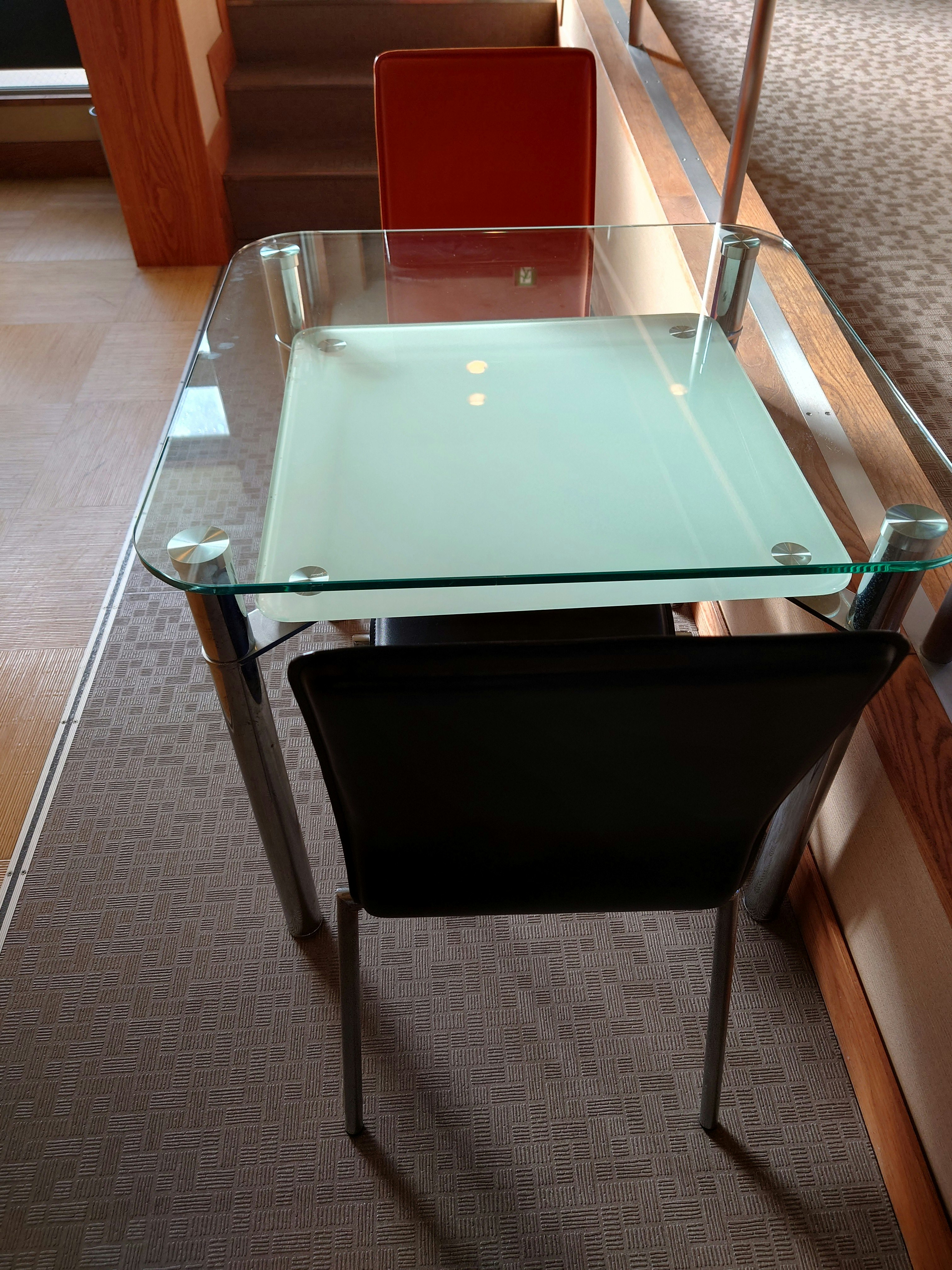indoor dining table with glass tabletop and chairs