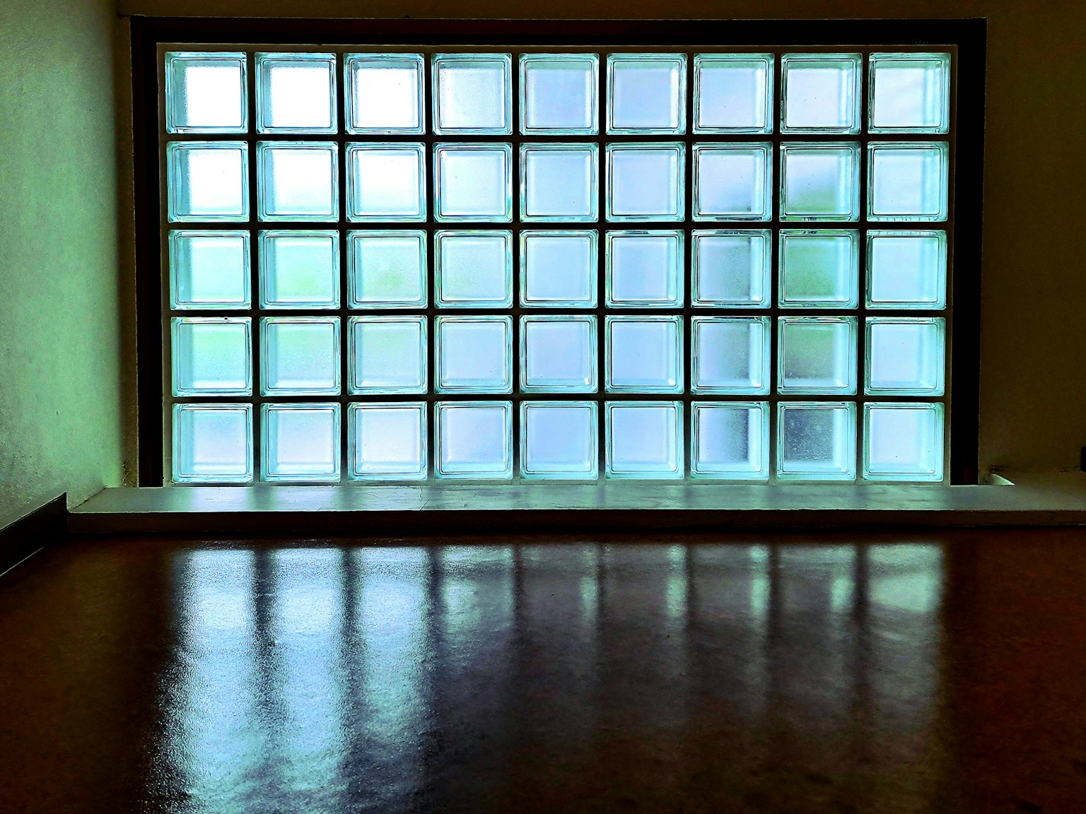 Interior view featuring a glass block window