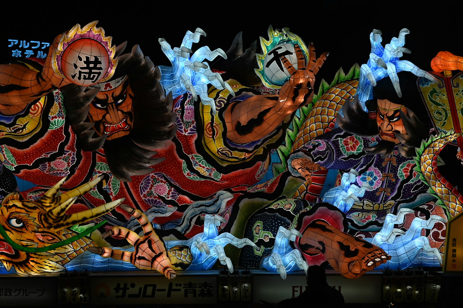 Vibrant nebuta festival float illuminated at night