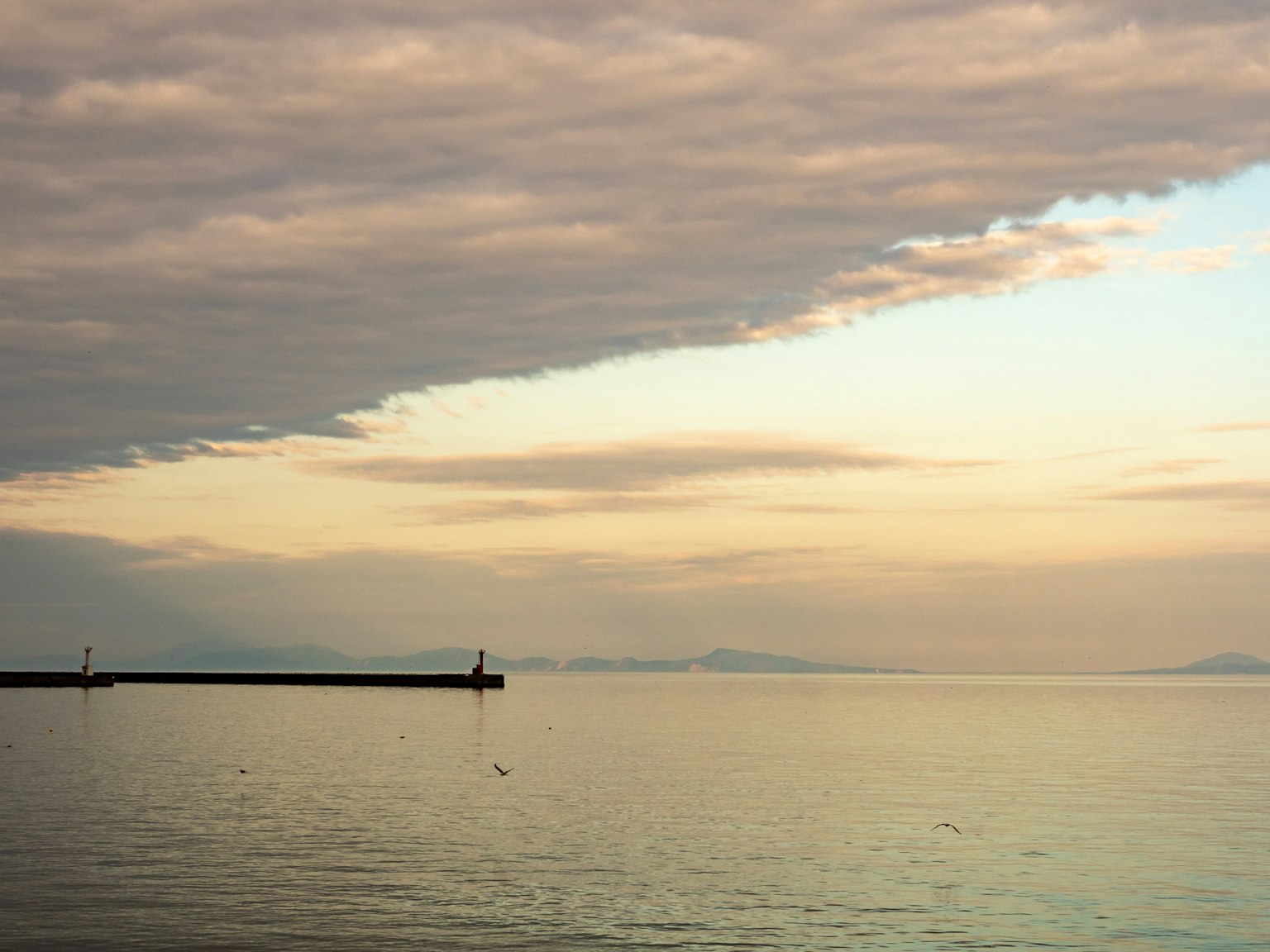 Calm sea with beautiful clouds at sunset