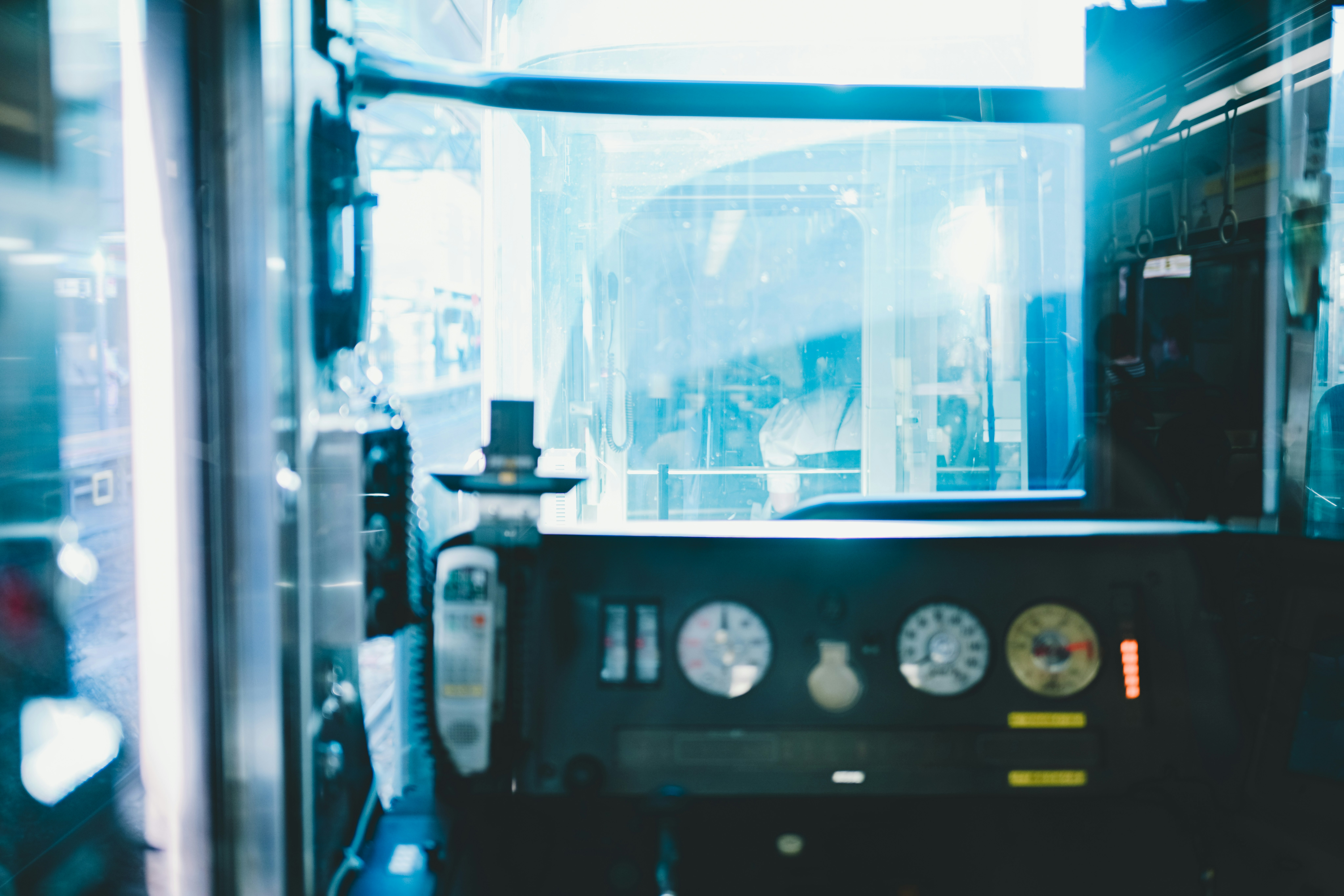 laboratory workspace with measuring instruments and gauges behind glass