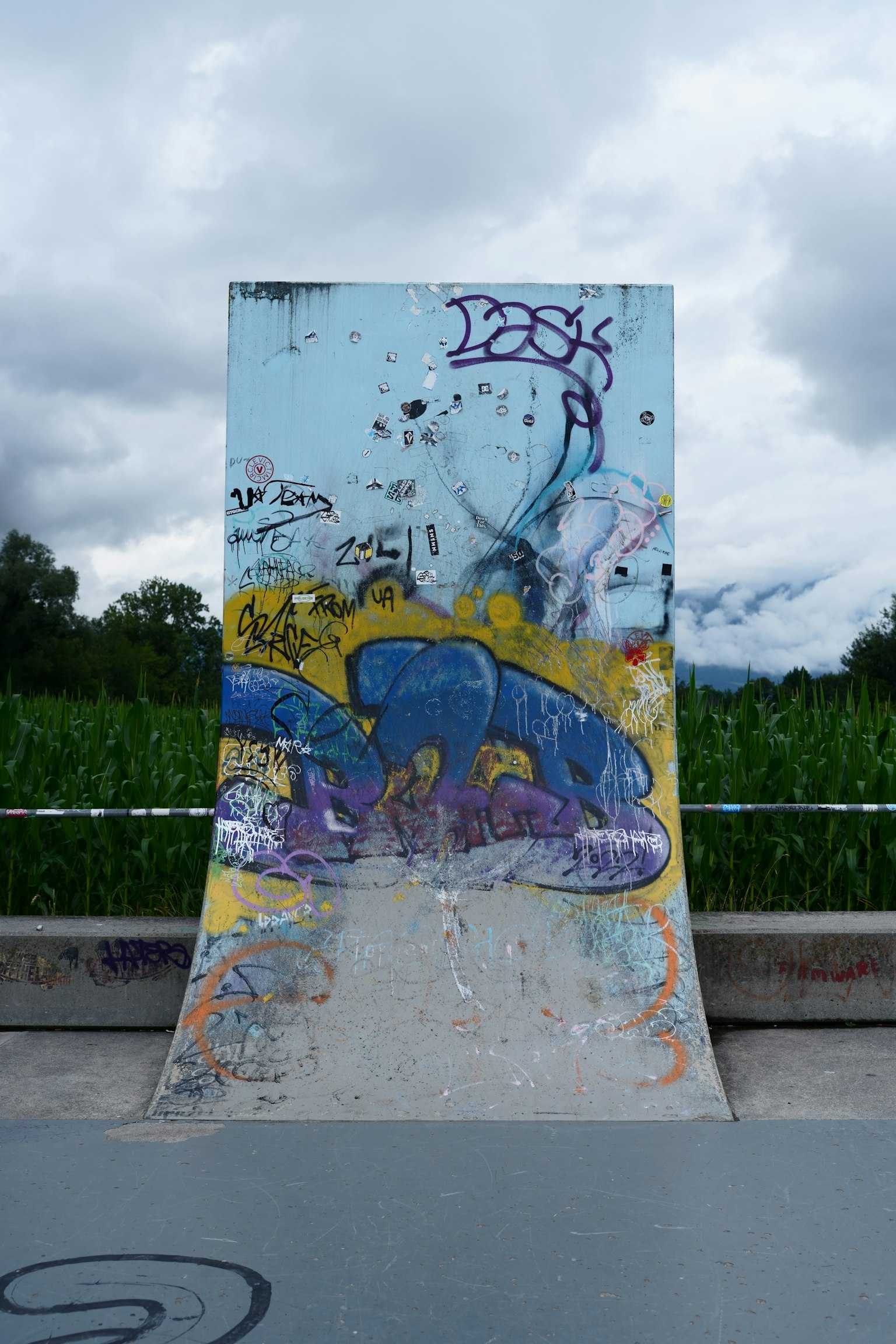 Colorful graffiti on a skate ramp with a green background