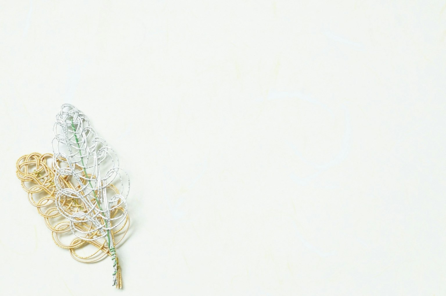 Gold and silver leaves on a white background