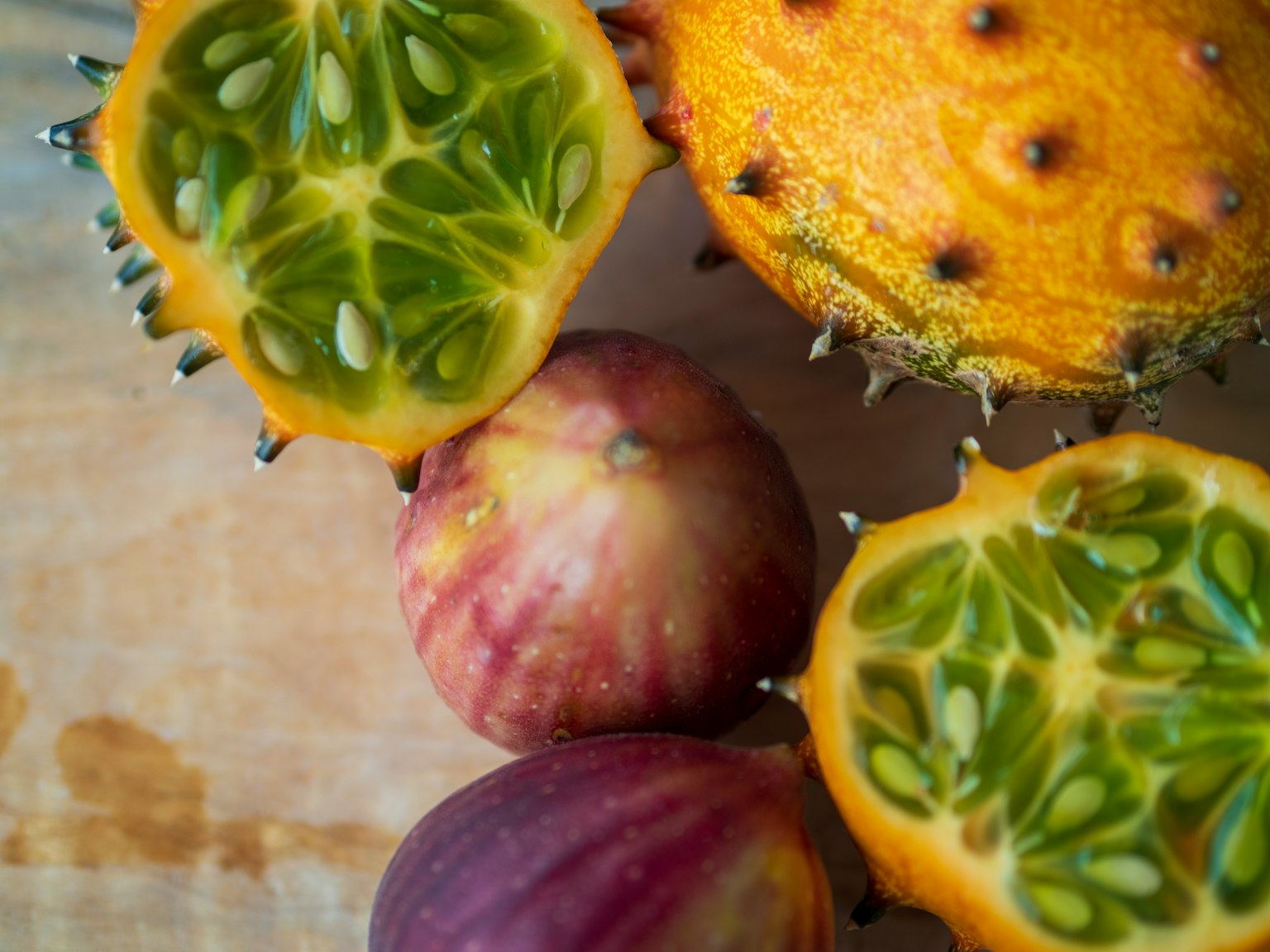 Image featuring vibrant yellow and purple fruits with unique textures