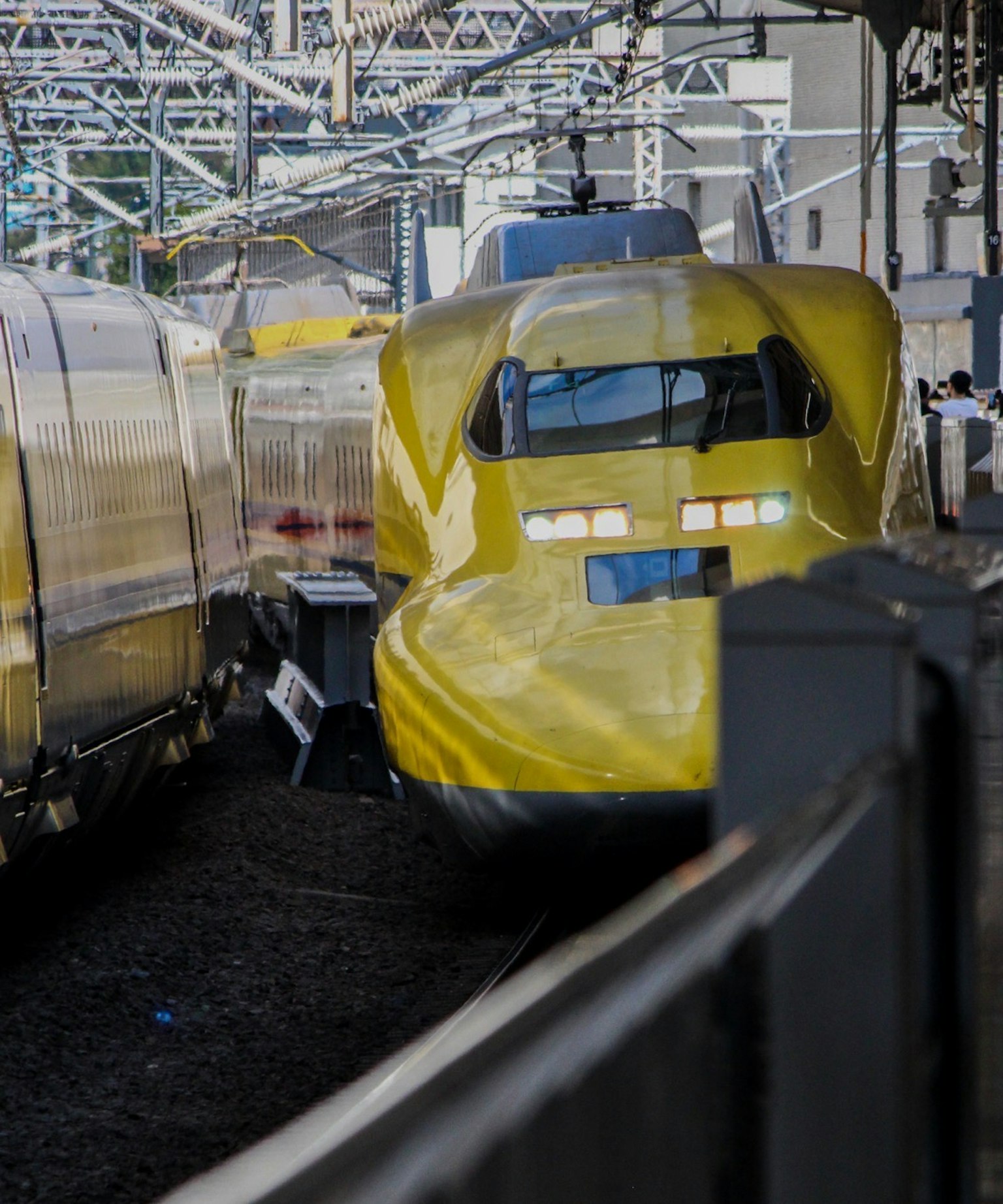 Yellow Shinkansen train at the station