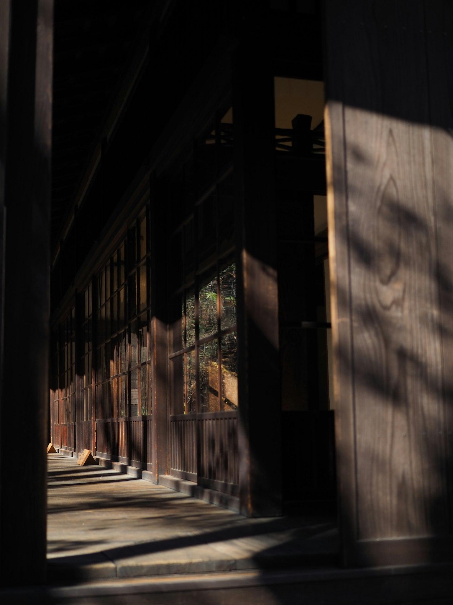 Wooden hallway with shadows and light