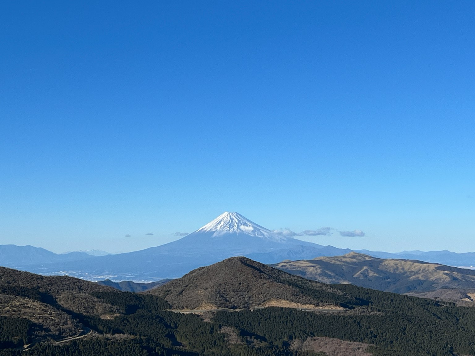 Scenic view of a snow-capped mountain under a clear blue sky