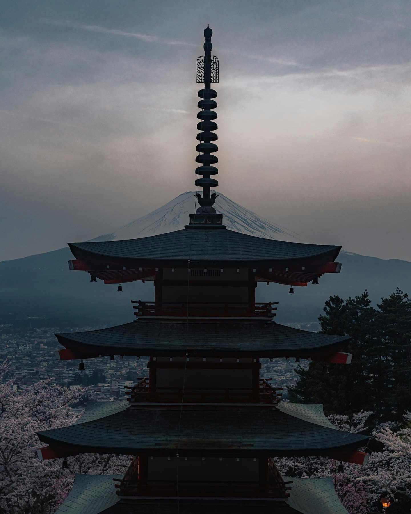 Silhouette of a pagoda by the seaside at dusk