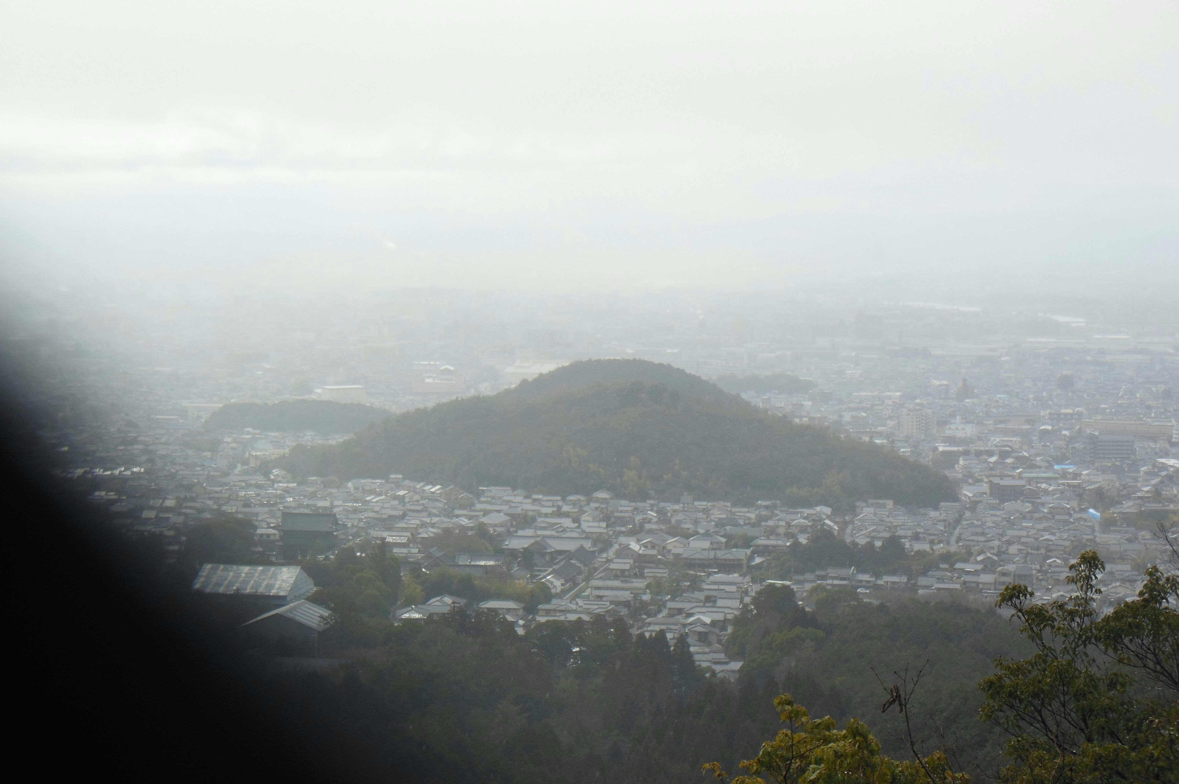hazy mountain range overlooking a city